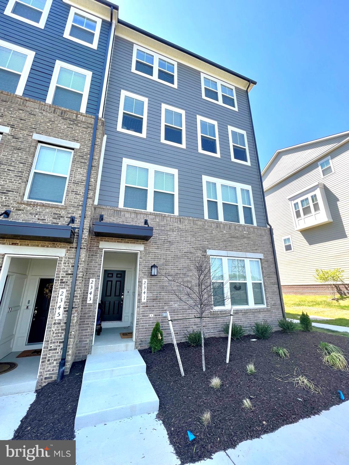 Welcome to contemporary living at its best! This stunning upper-level end unit Potomac Town Center condominium was built in 2022 and offers 3 bedrooms and 2.5 bathrooms, with a total of 2597 finished living area sq. ft. and a 1-car garage.

Step inside and experience the open concept layout, with a center gourmet kitchen featuring stainless steel appliances, tile backsplash, and quartz counters. The kitchen flows seamlessly into the great room on one side, and on the other side, you'll find plenty of space for a dining room and living room. Enjoy your morning coffee or evening cocktail on the balcony off the living room.

Upstairs, the large master suite boasts a spacious walk-in closet and a tiled master bath with a spacious shower and double sinks. The upper level also features two additional bedrooms that share a hall bathroom with a tub/shower and a convenient laundry room.

Stonebridge Town Center is a vibrant and dynamic shopping and dining destination located in Woodbridge, Virginia. This premier lifestyle center is a hub of activity and offers a unique mix of retail, dining, and entertainment options that cater to a wide range of interests.

The town center boasts over 400,000 square feet of retail space, featuring a variety of shops from high-end boutiques to popular chain stores.  Indulge in a wide range of dining options, with over 30 restaurants, cafes, and bars to choose from, ranging from casual to upscale.

Apart from shopping and dining, Stonebridge Town Center offers numerous entertainment options for visitors of all ages. The center hosts a state-of-the-art movie theater, as well as a lively outdoor plaza that features live music, community events, and seasonal festivities.  Sentara Northern Virginia Medical Center is across the street.

With easy access to interstate 95, commuting will be a breeze. Don't miss this incredible opportunity to experience contemporary living in the heart of the Potomac Town Center!