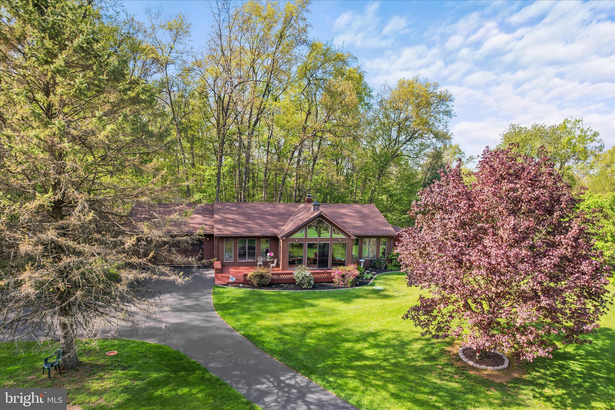 Beautifully maintained 3‑bedroom, 2‑bath home set on nearly 3 acres of peaceful countryside. This property offers the perfect blend of comfort, privacy, and natural beauty. Enjoy an inviting all‑seasons room filled with natural light—ideal for relaxing, entertaining, or taking in the surrounding views year‑round. The exterior features thoughtfully designed landscaping, mature trees, and wide‑open green space that enhances the home’s serene setting. With its excellent location and tranquil environment, this property truly embodies country living at its best while still offering convenient access to everyday amenities. A rare opportunity for those seeking space, charm, and a beautifully cared‑for home.