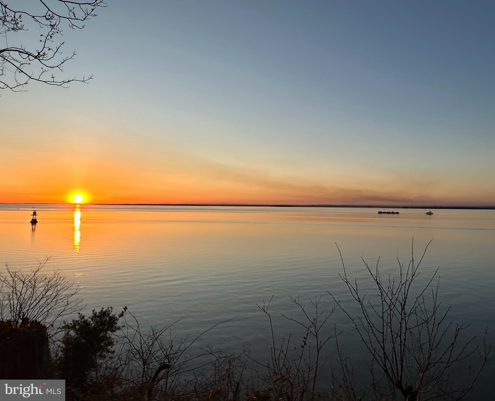 Gorgeous views from this Bayfront property.  What could be called the Million Dollar view,  but for half the price.   This compact bungalow has had extensive work done in the last 20 years but is  looking for a new owner to  enjoy  that  spectacular view and take the time to upgrade as  feel the need.  Steps down to a sandy beach with retaining wall to secure the pilings, recently done. Steps are steep but very secure,  however the  bottom steps  have been washed away.   Located in a well established community of Chesapeake Haven,  there is a Mandatory HOA  in this section.