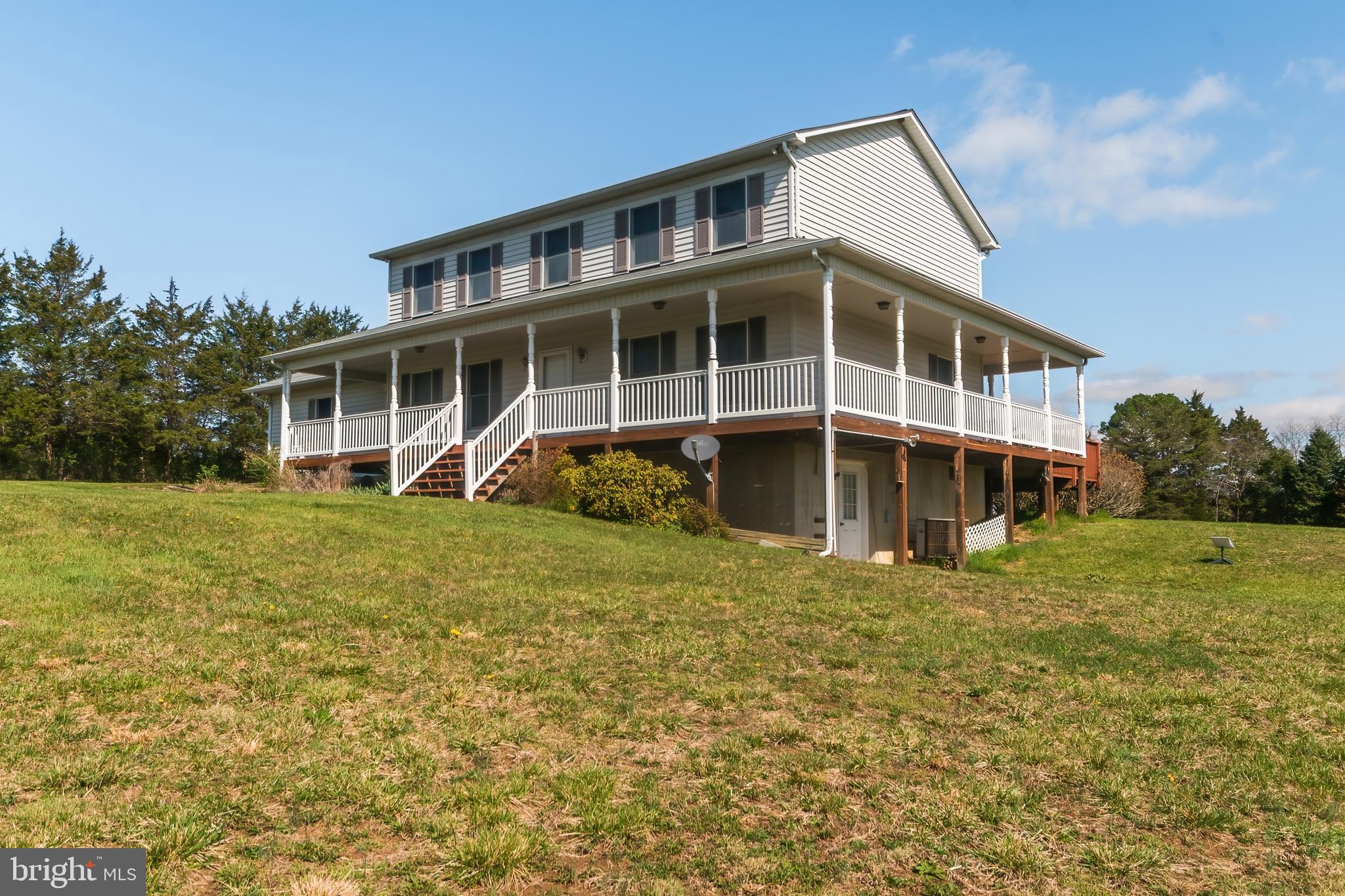 Enjoy morning coffee  on your wrap around porch while looking at Signal Knob mountain!!! 5 minutes to I-81 and I-66,  well maintained 3 bedroom, 2.5 bath home on 5 unrestricted acres...Middletown address in Warren County. Hardwood floors, huge primary suite with walk in closet, jetted tub and walk in shower. Out buildings (one with electric) and pond, RV pad with septic dump, water and electric. Large unfinished basement with workshop area, Culligan water softener. Main floor laundry room with utility sink, over sized 2 car garage. 4 year old roof.  Garbage disposal and aerobic septic system. Bring the chickens and horses, don't let this one get away...schedule your showing today!!