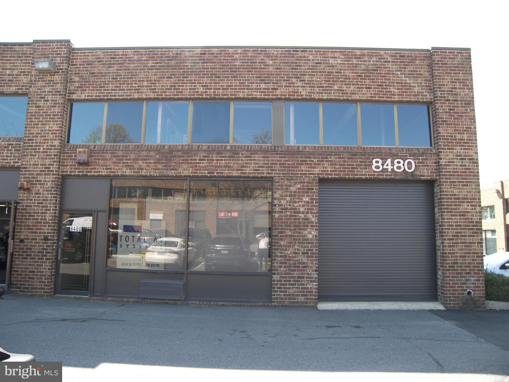 LOCATION/LOCATION - Zoned I-4, Commercial Condo Unit (30x60 ft) with second floor mezzanine. 1800 SF + mezzanine area approx. 800 sqft + additional space.  Mezzanine has 3 offices, lounge area, full bath and 2 extra rooms for storage. Main level has large office, 1/2 bath. Large storage area with 11" wide garage door access and ample unassigned parking for your customers. Ready for your biz.