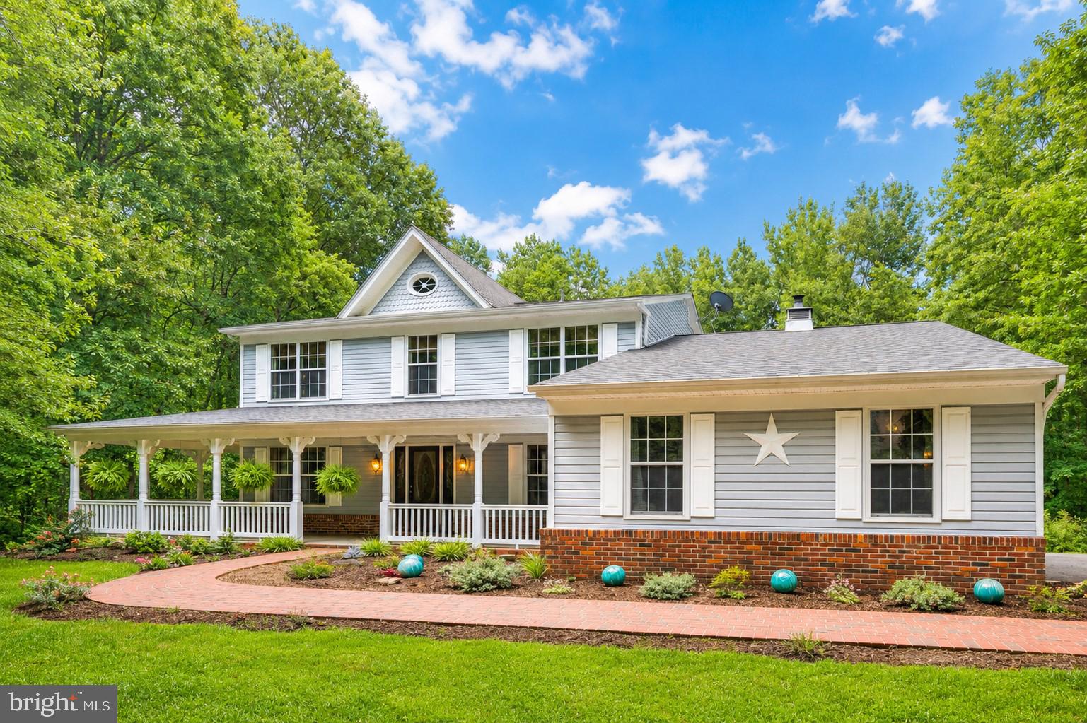 Welcome to this lovely custom-built home offering more than 4,000 square feet of living space on a private 2.24-acre lot. From the inviting front porch, step inside to a welcoming foyer flanked by formal living and dining rooms, both filled with natural light and ideal for everyday living or entertaining.

The updated kitchen features granite countertops, white cabinetry with under-cabinet lighting, a tile backsplash, pantry, and stainless steel appliances. Just off the kitchen, the bright breakfast area includes a sliding glass door leading to the screened-in rear deck, creating an easy indoor-outdoor flow. The spacious family room is a standout, featuring a vaulted ceiling, skylight, and a brick fireplace wall with a wood stove insert that adds warmth and character.

The main level also includes a private office with its own separate exterior entrance, making it a great option for a home-based business, client meetings, or a quiet work-from-home setup. A separate laundry room and convenient powder room complete the main level.

Upstairs, you will find four generously sized bedrooms, including the primary suite with a walk-in closet and an updated private bathroom. The hall bathroom has also been updated and features tile flooring, a tile surround, a large vanity, and a bathtub/shower combination.

The finished lower level provides even more flexible living space, including an open recreation room, den, playroom, and abundant storage. Outside, enjoy the screened-in rear deck, expansive backyard, and two storage sheds. The property also offers a two-car side-loading garage and an extra-long driveway with plenty of parking.

Enjoy the privacy and space of a 2.24-acre homesite while still being just a short drive from major commuter routes, shopping, dining, and entertainment. With its flexible layout, generous living areas, and peaceful setting, this home offers the ideal combination of comfort, convenience, and room to grow.