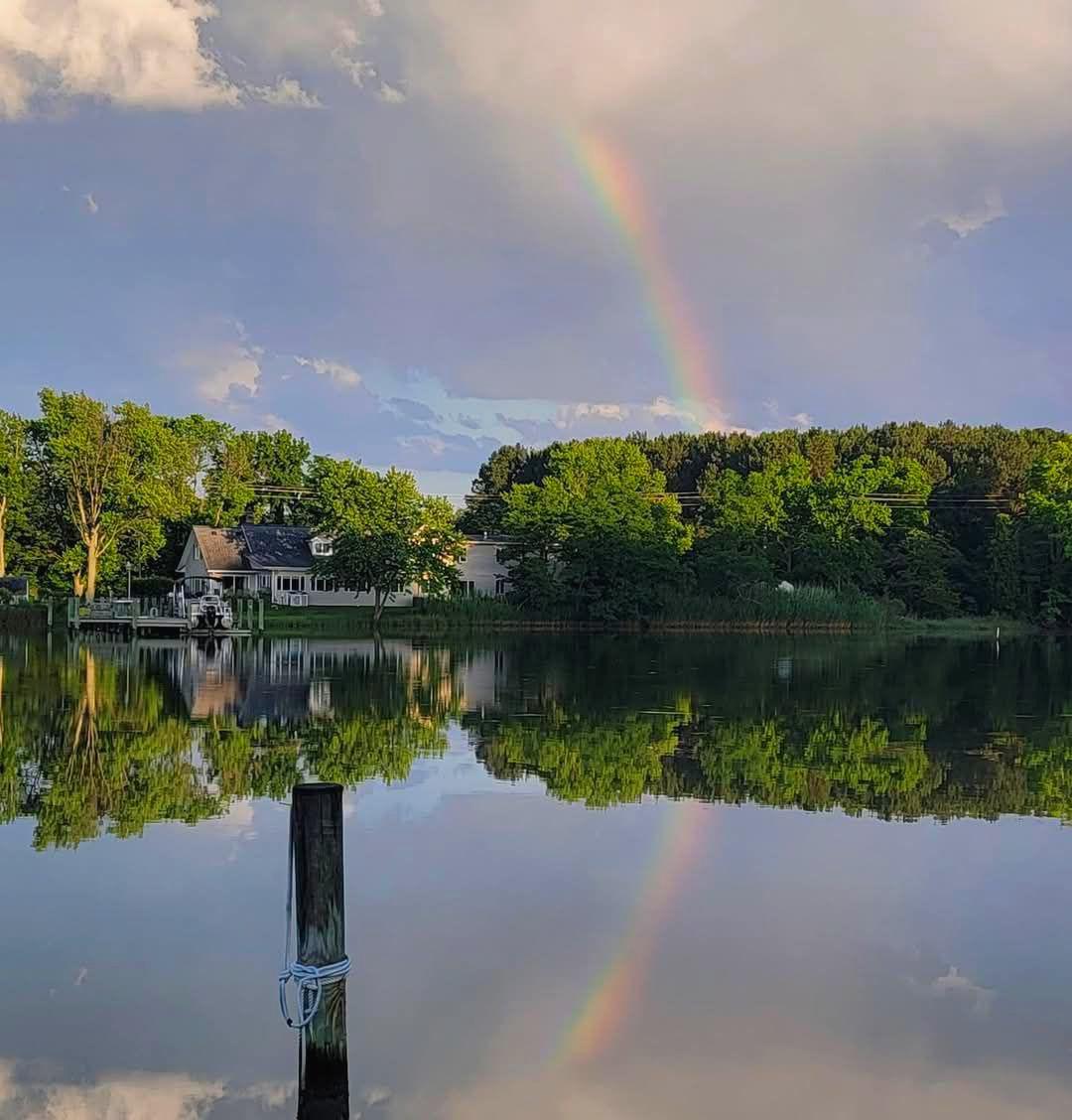 Are you finding yourself longing for a peace and quiet that only life on the water can bring?  Come home to stargazing without light pollution, dinner on the patio watching osprey, herons and geese in the creek. Spend your weekends boating, fishing, crabbing on the pier or taking long walks with both water and farm views. Invite your friends and family because this home has 6 bedrooms and 3 bathrooms with a floorplan perfect for a multi family living situation or even a vacation rental. The first floor living room is both cozy with the fireplace and also fun with the bar area and room to dance or game. You'll love the natural light coming into the kitchen with expansive windows bringing the creek views as close as you can get without stepping outside.  So much granite counter space especially with the mobile island, newer appliances, an undermount sink, appliance garage and desk space might just make this your favorite room of the house. Whether you're having elaborate formal meals or casual fare, the dining room seats as many as you want and a fireplace and amazing views to top it off.  Completing the main level are 2 spacious bedrooms, a full bath and laundry room with a 2nd shower.  You'll also appreciate the side entrance of the home that open to a large entryway currently used as a library that can double as an office with access to the 2nd level leading to another primary bedroom, ensuite bathroom with soaking tub and separate shower. Plus 3 additional bedrooms, 3rd full bath and common space where you'll discover the spiral staircase taking you back to the lower living room.  Plenty of parking with 2 paved driveways, a sideload attached garage and 2nd single car garage/shed plus another shed for storage. The covered front porch brings you panoramic views of a farm and woods where wildlife roam.  The side and backyard have unobstructed views of St. Jerome Creek where you can dock your boat or launch your kayak with easy quick access to the Chesapeake Bay.  Ridge is just far enough away from the hustle and bustle but still close enough to shopping and commuting.  Locally you'll enjoy the waterfront restaurants, farmstands and state park. Just a few minutes to historic St. Marys City and St. Marys College.