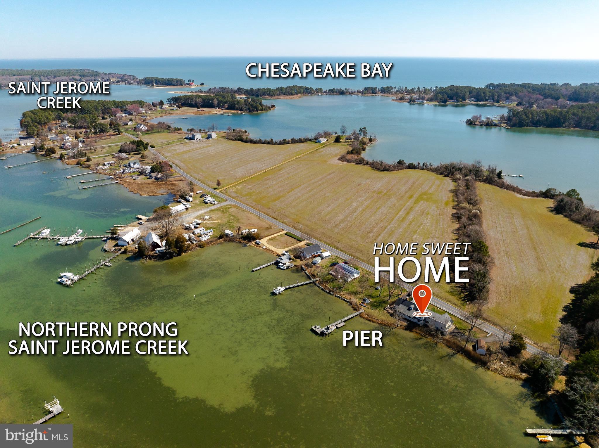 Are you finding yourself longing for a peace and quiet that only life on the water can bring?  Come home to stargazing without light pollution, dinner on the patio watching osprey, herons and geese in the creek. Spend your weekends boating, fishing, crabbing on the pier or taking long walks with both water and farm views. Invite your friends and family because this home has 6 bedrooms and 3 bathrooms with a floorplan perfect for a multi family living situation or even a vacation rental. The first floor living room is both cozy with the fireplace and also fun with the bar area and room to dance or game. You'll love the natural light coming into the kitchen with expansive windows bringing the creek views as close as you can get without stepping outside.  So much granite counter space especially with the mobile island, newer appliances, an undermount sink, appliance garage and desk space might just make this your favorite room of the house. Whether you're having elaborate formal meals or casual fare, the dining room seats as many as you want and a fireplace and amazing views to top it off.  Completing the main level are 2 spacious bedrooms, a full bath and laundry room with a 2nd shower.  You'll also appreciate the side entrance of the home that open to a large entryway currently used as a library that can double as an office with access to the 2nd level leading to another primary bedroom, ensuite bathroom with soaking tub and separate shower. Plus 3 additional bedrooms, 3rd full bath and common space where you'll discover the spiral staircase taking you back to the lower living room.  Plenty of parking with 2 paved driveways, a sideload attached garage and 2nd single car garage/shed plus another shed for storage. The covered front porch brings you panoramic views of a farm and woods where wildlife roam.  The side and backyard have unobstructed views of St. Jerome Creek where you can dock your boat or launch your kayak with easy quick access to the Chesapeake Bay.  Ridge is just far enough away from the hustle and bustle but still close enough to shopping and commuting.  Locally you'll enjoy the waterfront restaurants, farmstands and state park. Just a few minutes to historic St. Marys City and St. Marys College.