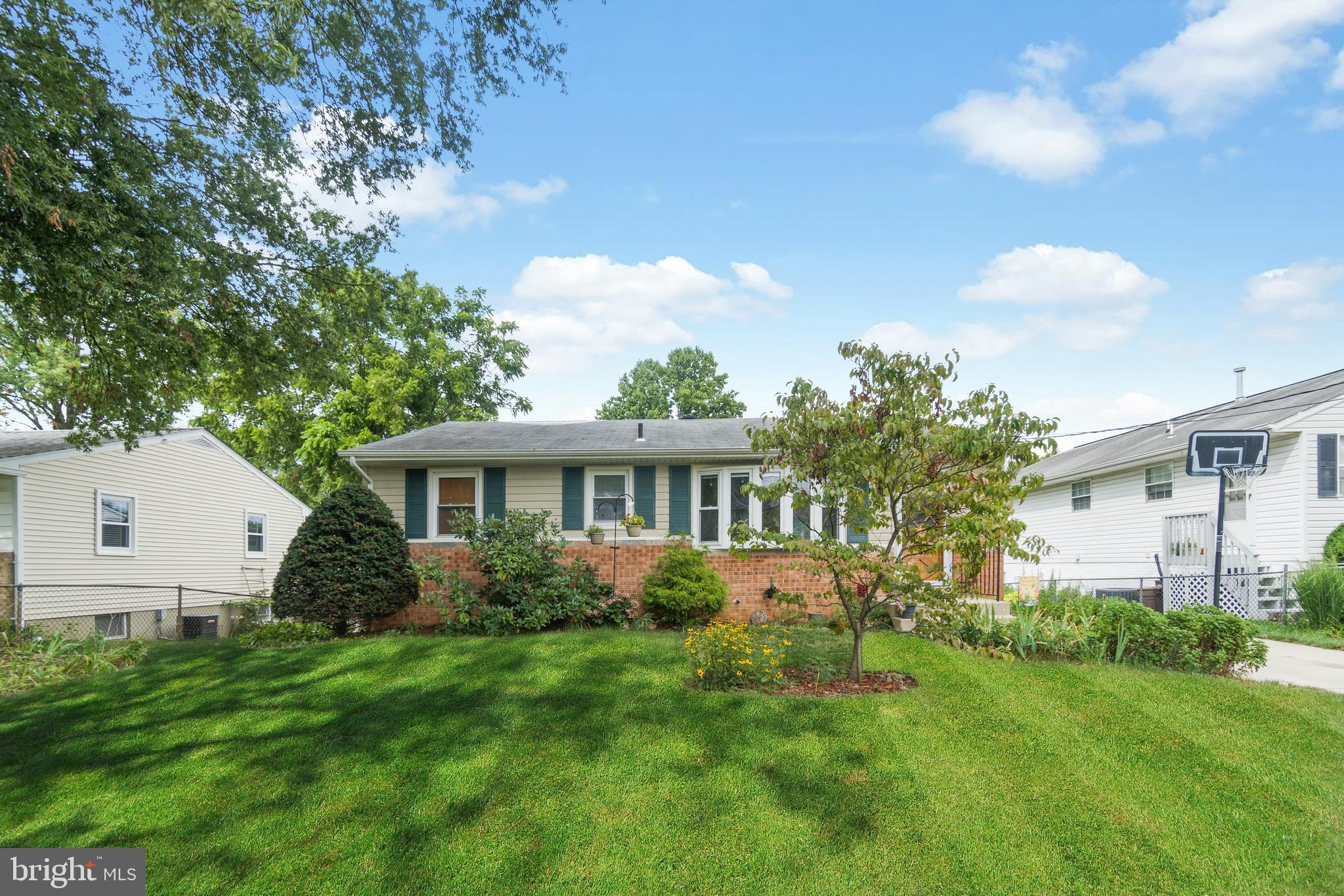 Beautifully updated 3-bedroom, 2-bath home offering the perfect blend of timeless charm, modern updates, and exceptional versatility in a highly desirable Beltsville location.

From the moment you arrive, you'll appreciate the inviting curb appeal with its manicured landscaping and spacious front yard. Inside, beautiful hardwood floors, abundant natural light, and elegant trim create a warm and welcoming atmosphere throughout the main level.

The updated kitchen is the heart of the home, featuring white cabinetry, stainless steel appliances, gas cooking, beautiful countertops, a stylish tile backsplash, and generous cabinet and prep space—perfect for everyday living and entertaining. The open living and dining areas flow seamlessly, creating an ideal space for family gatherings and hosting guests.

The main level offers three spacious bedrooms with hardwood flooring and ample closet space, along with a beautifully renovated full bathroom featuring modern finishes.

The finished lower level provides incredible flexibility with three spacious bonus rooms, a kitchenette, a second full bathroom, laundry area, and a separate walkout entrance. Whether you need guest space, a home office, gym, playroom, or hobby room, this level offers endless possibilities.

Step outside to a private, fully fenced backyard surrounded by mature trees and lush landscaping—perfect for relaxing, entertaining, gardening, or enjoying summer evenings. A large storage shed offers abundant space for tools, lawn equipment, bikes, and seasonal storage.

Ideally located just minutes from shopping, restaurants, Costco, Aldi, parks, and major commuter routes including I-95, I-495, and the BW Parkway, this home combines comfort, convenience, and versatility in one exceptional package.

Move-in ready and thoughtfully updated, this Beltsville home is ready for its next chapter.