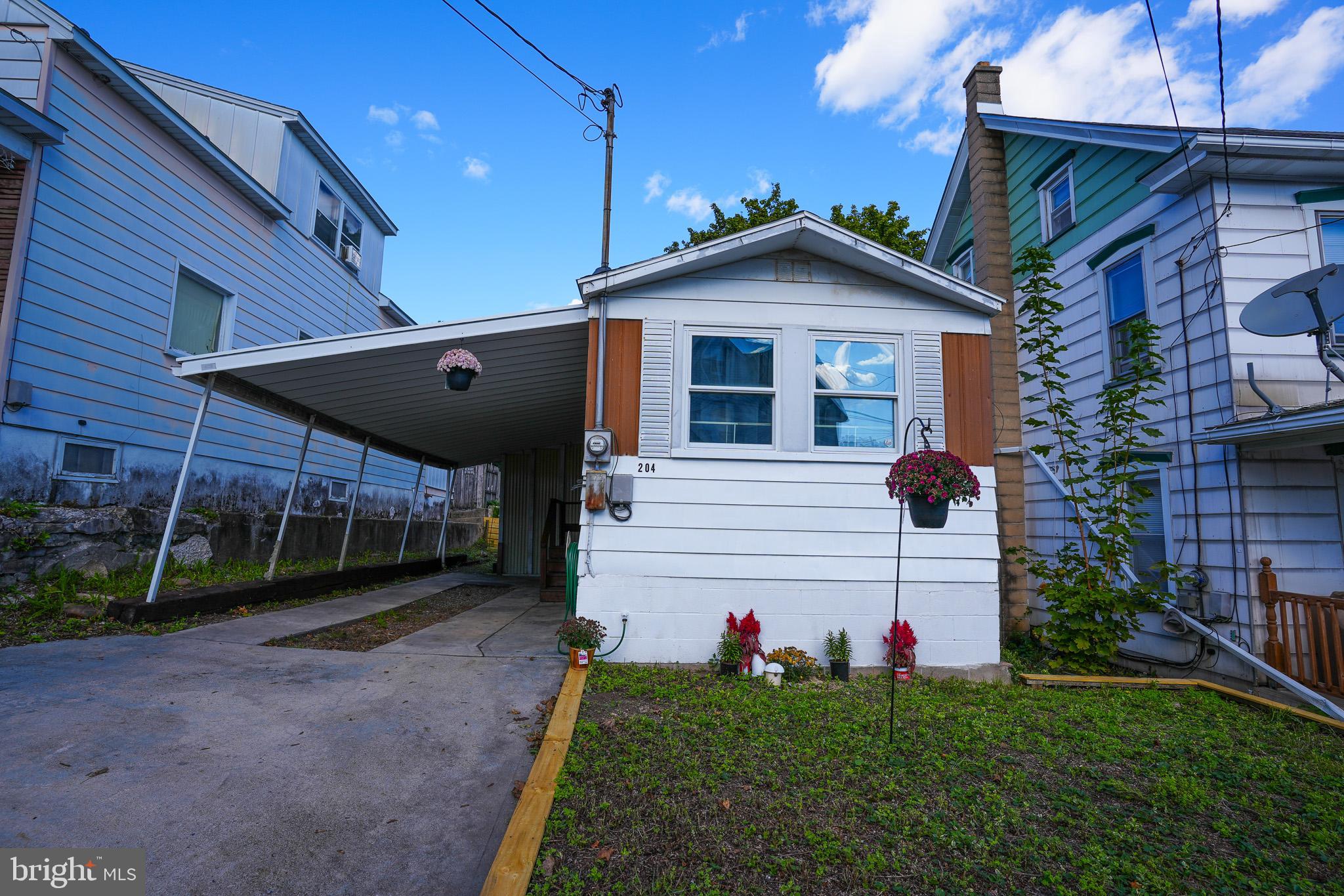 This charming 3-bedroom, 1-bath mobile home in Lehighton is a perfect blend of comfort and convenience. Inside, you'll find a bright living room filled with natural light, an inviting eat-in kitchen, and a full bath that includes a laundry area for added ease. The home is well-maintained and offers everything you need in a cozy, functional layout. Outside, enjoy the benefits of a fenced-in backyard, ideal for pets or outdoor activities, along with two storage sheds for all your tools and equipment. The property also features a driveway with an attached carport, plus additional off-street parking accessible via the alley. This solid home is priced to sell, making it an excellent opportunity for first-time buyers or those looking for a great investment!