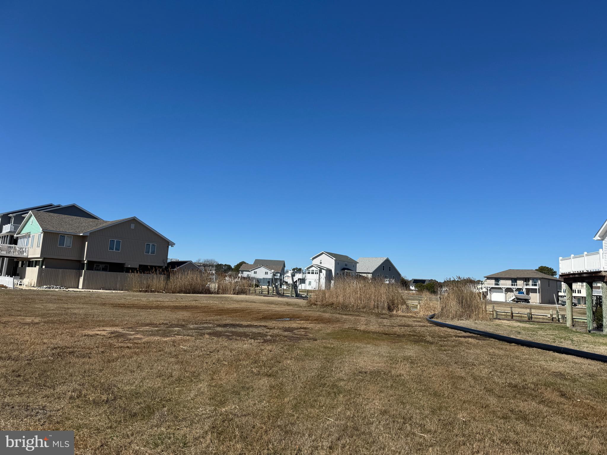 Don't miss out on the opportunity to purchase this canal front lot. Imagine building a beautiful piling home that you and your friends and family can enjoy for many years to come. Whether you are looking to live here year round or have a fabulous vacation home, this is the perfect homesite for you. Start enjoying all that Captain's Cove has to offer. The many amenities include 2 outdoor pools & 1 indoor pool, tennis courts, the community marina & boat ramp, exercise room, the playground and the Marina Club. Just minutes to the beach and a short ride to Ocean City, MD, Chincoteague Island or Assateague Island.