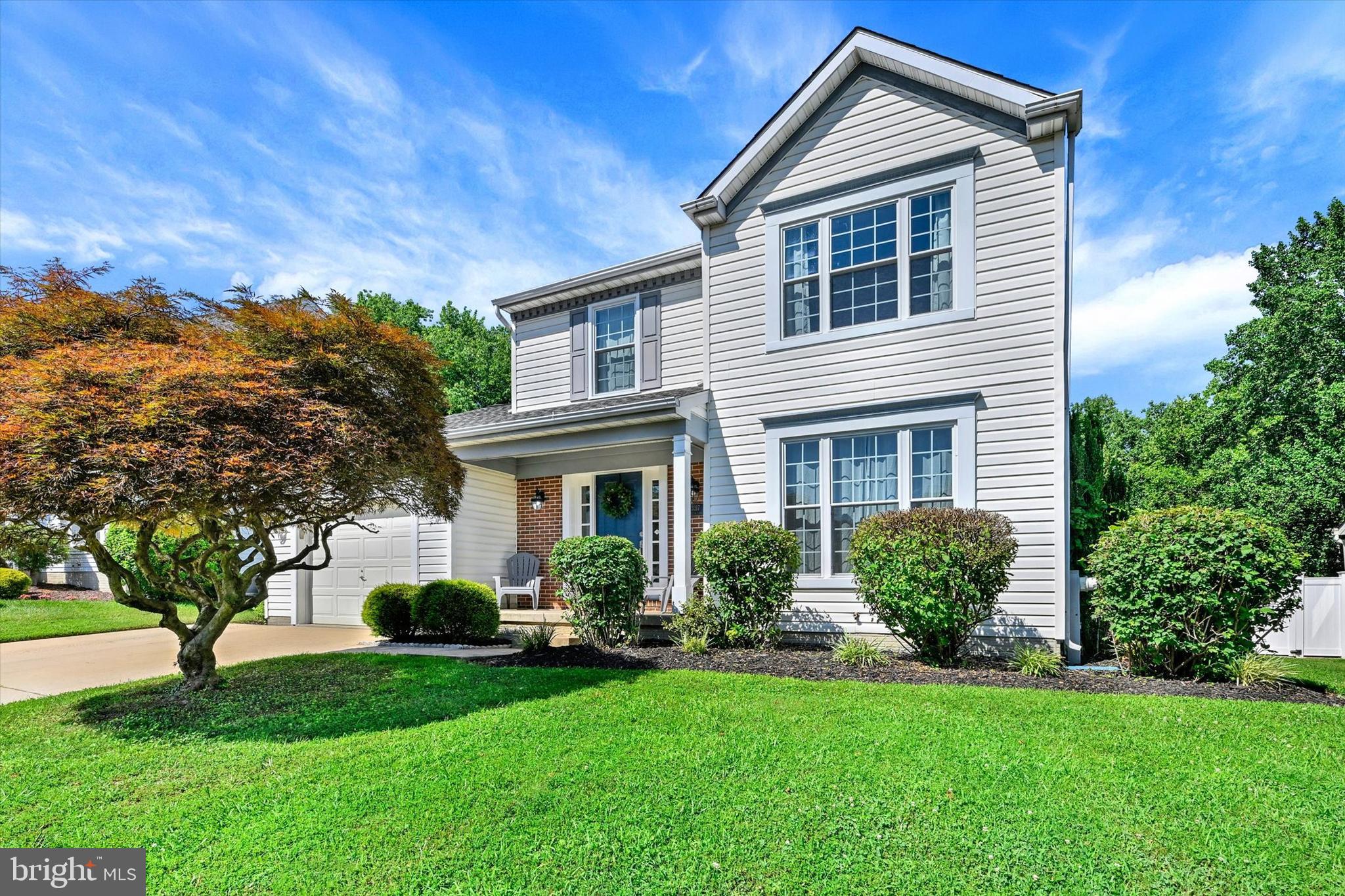 Welcome to this well maintained Colonial in the sought after Constant Friendship community! A welcoming foyer with luxury vinyl plank flooring and a convenient coat closet greets you upon entry. To the right, the formal living room offers a flexible space currently used as a playroom, while the separate dining room features a charming bay window overlooking the rear yard. The updated kitchen is designed for both everyday living and entertaining, showcasing two toned painted cabinetry, granite countertops, stainless steel appliances, a center island, luxury vinyl plank flooring, and a spacious eat-in area. Just off the kitchen, step down into the inviting family room with luxury vinyl plank flooring, a French door leading to the composite deck, and a cozy fireplace (currently not functioning). A main level powder room completes the first floor. Upstairs, you'll find three comfortable bedrooms, including a spacious primary suite with an updated en-suite bath. Both full bathrooms were renovated in 2019 and feature luxury vinyl plank flooring and updated vanities, with the primary bath also offering a deep soaking tub. The finished lower level provides additional living space with a large recreation room, walk up access to the rear yard, and a versatile area currently being used as a guest bedroom. The laundry area is also located on the lower level. Outdoor living is a highlight with the composite deck, added in 2022, overlooking the backyard. Conveniently located near shopping, dining, parks, and major commuter routes, this home offers the perfect combination of space, comfort, and convenience.