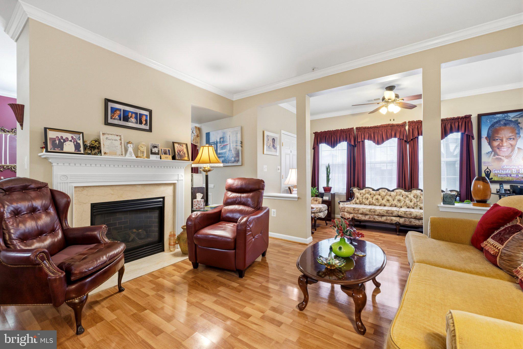 This charming 2-bedroom, 2-bathroom condo offers roughly 1,400 sq. ft. of living space, perfect for creating lasting memories. The open floor plan invites natural light, enhancing the warmth of the wood floors and crown moldings throughout. Enjoy culinary delights in the well-appointed kitchen featuring new stainless steel appliances. The cozy living area, complete with a fireplace, is ideal for relaxation or entertaining friends. The primary suite boasts an en-suite bath, ensuring comfort and privacy. Step outside to enjoy the beautifully landscaped garden views, or take advantage of the community amenities, including indoor and outdoor pools, a fitness center, and a welcoming community center. With custodial services, lawn maintenance, and security features like a gated entrance and intercom system, you can enjoy a carefree lifestyle. Cameron Grove also offers a variety of social activities and spaces, from a library to meeting rooms, ensuring there's always something to engage in. Assigned parking and easy access to transportation services make this home as convenient as it is inviting. Embrace a lifestyle of comfort and community in this delightful condo! Recent updates include new stainless steel appliances, water heater and HVAC.