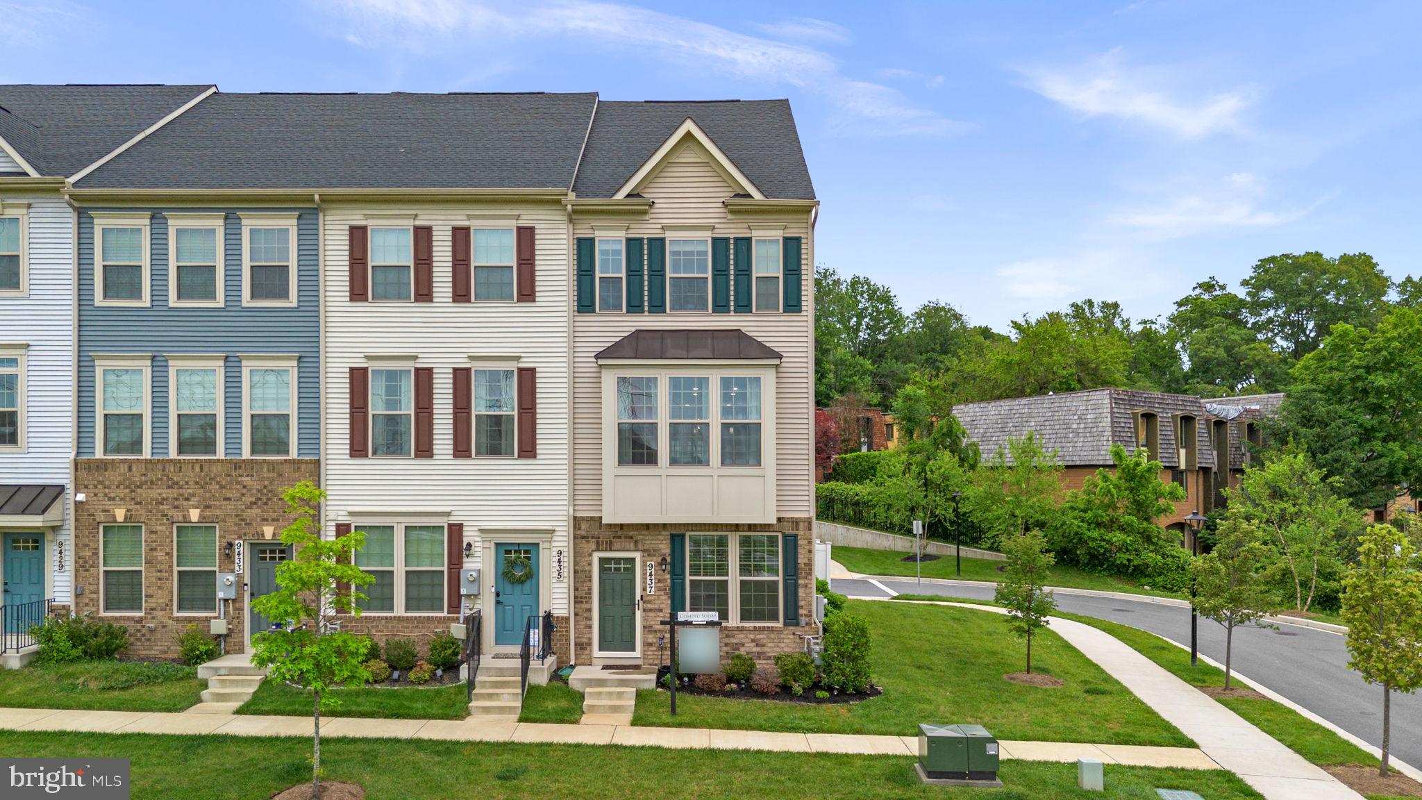 Welcome to 9437 Oak Grove Lane — a beautifully maintained end-unit townhome built in 2022 that blends modern design, functional living, and low-maintenance convenience. With 3 bedrooms, 3.5 bathrooms, and nearly new major systems, this move-in ready home offers the style, flexibility, and peace of mind today’s buyers are looking for.

The entry level features a private bedroom and full bathroom, creating an ideal space for guests, a home office, workout room, or flexible living setup. This level also provides direct access to the attached 1-car garage with additional storage space.

The main level is the heart of the home, thoughtfully designed for both entertaining and everyday living. The open-concept layout seamlessly connects the spacious living area, dining space, and kitchen, while oversized windows and the premium end-unit placement fill the home with natural light throughout the day. Modern flooring, recessed lighting, and contemporary finishes create a polished yet welcoming feel, while the custom accent wall adds warmth and designer character.

The gourmet kitchen features white cabinetry, stainless steel appliances, quartz countertops, a large center island with breakfast bar seating, generous prep space, and abundant storage. Just off the dining area, step outside to the spacious deck with views of the community green space — the perfect setting for morning coffee, outdoor dining, or relaxing evenings.

Upstairs, the home continues its thoughtful layout with spacious bedrooms and well-appointed bathrooms designed for comfort and privacy. The primary suite features a double vanity, oversized standing shower with built-in bench seating, and modern finishes throughout. The laundry area is conveniently located on the bedroom level for added ease.

Built in 2022, the home still feels nearly new while offering the benefit of upgrades already completed. The roof, HVAC system, hot water heater, and windows are all original to the home, allowing for truly low-maintenance living.

Conveniently located near shopping, dining, parks, commuter routes, and Montgomery Village amenities, this beautifully upgraded home offers the perfect combination of modern style, natural light, flexible living space, and everyday convenience.
