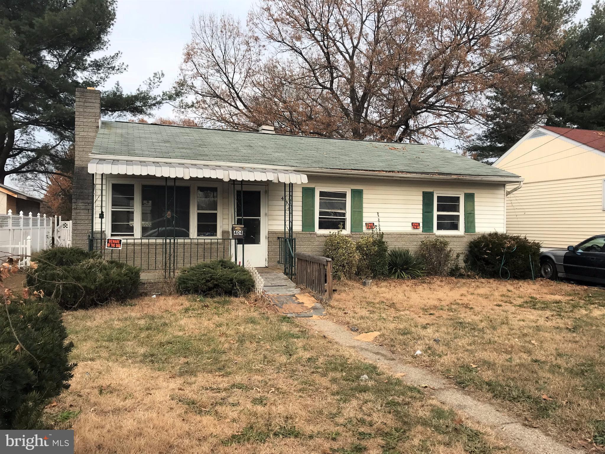 Rancher with 3 Bedrooms and 2 full baths. Wood floors, fenced yard and a nice large room in the back to spread out. This home needs a total rehab, and can be beautiful again!  Tons of possibilities! Cash offers only please.