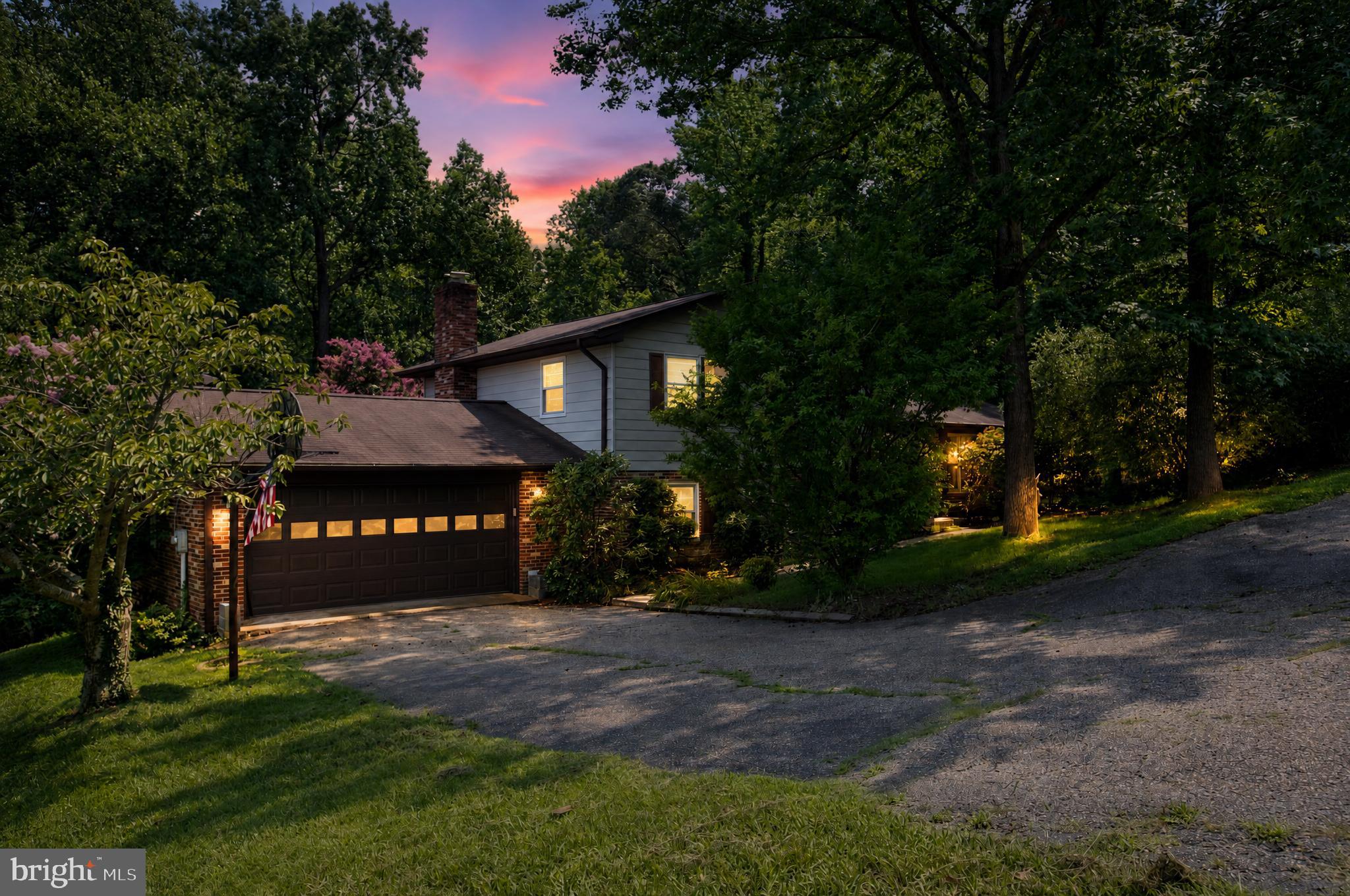 Private wooded setting, a versatile four-level layout, and expansive outdoor living near the Patuxent River and local marinas.
This 4-level split offers 5 bedrooms, 3 full bathrooms, and a stunning space to spread out while enjoying a peaceful setting. You'll have the flexibility to accommodate a growing household, guests, or work-from-home needs. 
Inside, you’ll find hardwood floors, a formal living room, and a separate family and dining rooms. The spacious kitchen has abundant cabinetry, generous prep space, and a center island.
Just steps away, the inviting family room features a brick fireplace and large windows overlooking the backyard for you to enjoy natural scenery.
The fully finished walkout basement includes daylight windows, interior connecting stairs, outside rear access, and multiple finished areas that can easily become a recreation room, home office, fitness space, hobby room, or guest accommodations.
Outside, the expansive rear deck is ready for weekend barbecues, outdoor dining, or relaxing beneath the pergola. 
The circular driveway, mature landscaping, and wooded surroundings complete a property that offers both privacy and practical everyday living in one of Lexington Park's established residential settings.
Conveniently located near Three Notch Road (MD-235), schools, Town Creek Community Pool, and West Basin Marina, you have quick access to essentials while staying close to waterfront recreation.
Schedule your private tour and discover the space, setting, and possibilities this distinctive home has to offer.

Some images may reflect virtual staging or digital editing, including removal of personal property, to help showcase the home.
