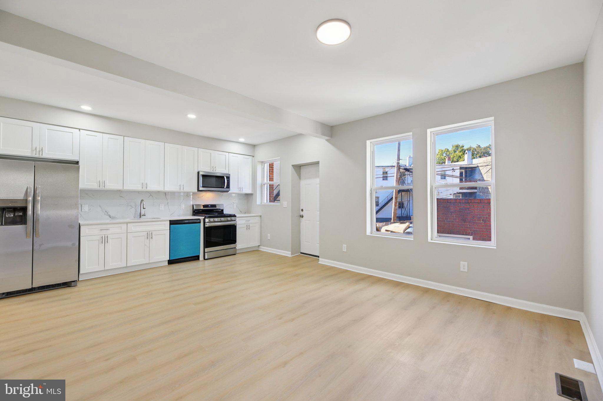 Back on Market! Buyer financing fell through at the finish line—no fault of the home. This is your second chance to own this stunning rowhouse! 
Beautifully renovated from top to bottom, this spacious 6-bedroom, 5-bathroom rowhome offers a thoughtful blend of modern updates and flexible living space—an especially rare find in this area with such a high number of bathrooms. The home features a stylish kitchen with stainless steel appliances, updated flooring throughout, and a bright, well-designed common area that provides a comfortable and practical space for everyday living and gatherings.

With multiple bedrooms and bathrooms, the layout provides exceptional convenience and flexibility for a variety of living needs, whether accommodating a large household, extended family, guests, or dedicated home office space.

Ideally located just steps from Johns Hopkins University and the Medical Campus, the property is set in a vibrant, well-established neighborhood with easy access to education, healthcare, dining, and public transit. Whether you’re looking for a spacious primary residence or a home that adapts to changing needs over time, this property offers comfort, functionality, and an outstanding location.