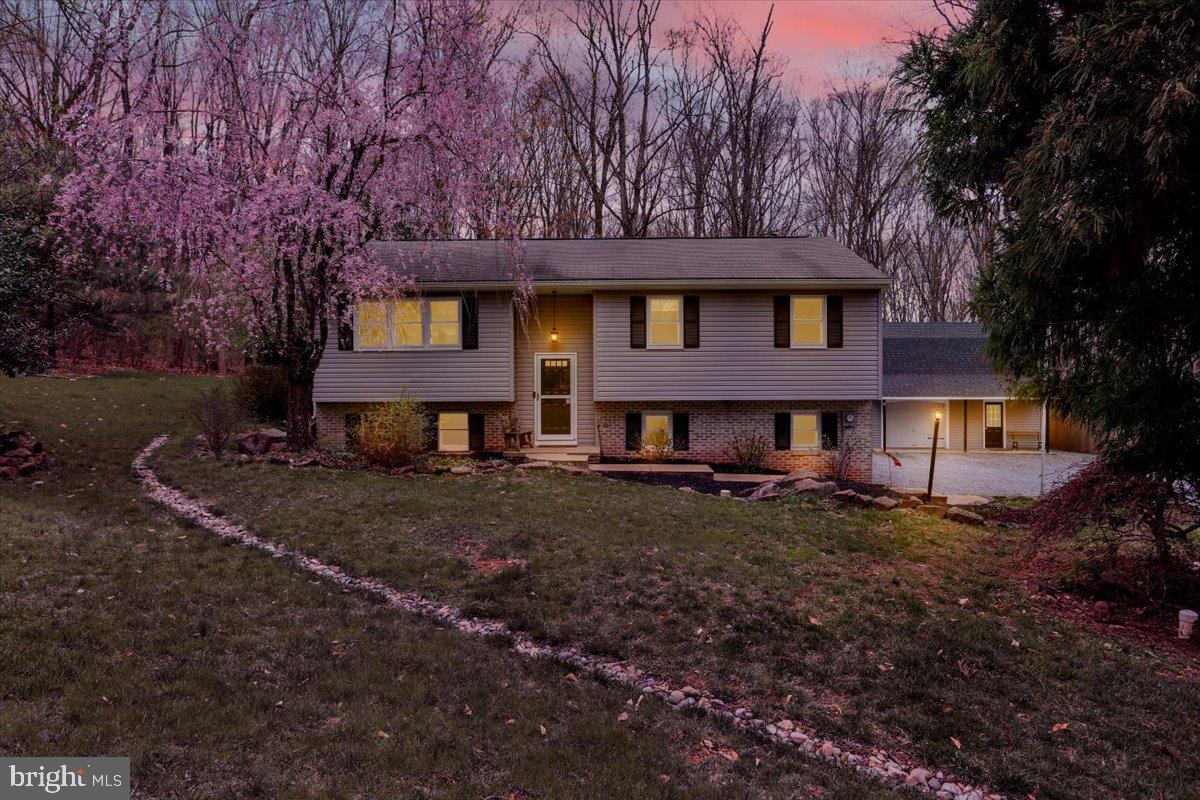 If you're looking for a 4BR/3.5 Bath home in a beautiful secluded wooded setting, you may have found your dream home. Natural maple cabinets and granite countertops give the kitchen timeless look.  A Newly remodeled Owner's Suite with shower and luxurious soaking tub and walk in closet are sure to provide a peaceful escape. 3 Br's with 2 full baths on the upper level provide lots of possibilities and flexibility, with the largest BR having it's own private bath. A lower family room with a wood stove and brick surround provides another cozy gathering space loaded with possibility of uses. The large lot with trees and plantings will surround you in nature to be enjoyed from your partially covered deck. The detached garage has a large loft above that can accommodate a variety of uses. 
This property is located just off Rt 625, centrally between the Reading and Morgantown exchanges of the PA turnpike, you are less than 15 minutes from heading either direction.