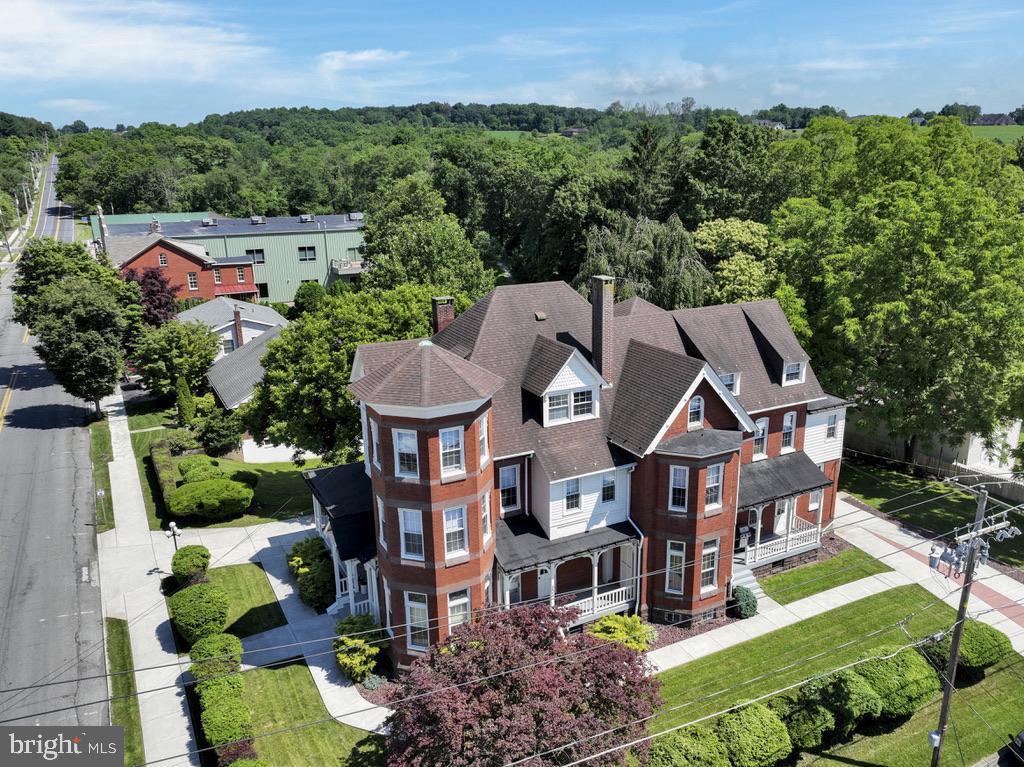 Impressive space for a law office or other professional services with living space.  Exceptional old world Victorian era mansion oozes with charming original details including dozens of stained glass windows, 12 foot ceilings, exquisite chestnut woodwork and  decorative antique fireplaces all nestled in the delightful small town of Orwigsburg.  This executive space includes the entire first floor with over 2000 square feet of living space, 4 porches, and the private use of the driveway and garage. In addition to four expansive rooms that can be used as living, family, bedrooms or office this home features an exquisite kitchen with granite counters, marble flooring, and a counter bar which flows into the large dining area and adjacent laundry room.  The main bathroom is enhanced with a garden tub, dual sink and cabinets galore. A large pocket door allows for low-impact professional space in the front with living quarters in the rear. Storage and other space available in the very nice basement (has direct access). 
Owner is a licensed realtor.