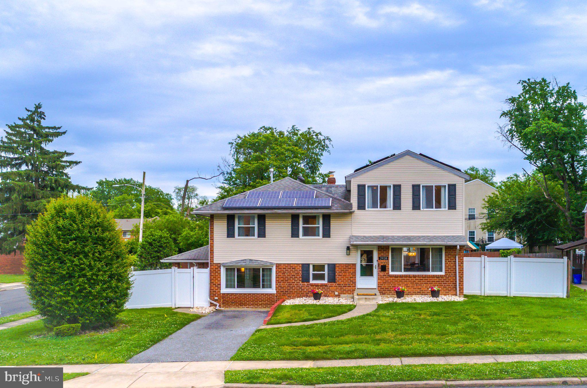 Beautifully maintained split-level home situated on a spacious corner lot in desirable Delaware County, PA! Offering over 2,100 sq. ft. of living space, this home features a bright living room, dining area, and updated kitchen with access to a large deck overlooking the generously sized backyard, perfect for entertaining. The upper levels offer 4 bedrooms, including a private primary suite with a custom walk-in closet by Closets by Design and an en-suite bath. The finished lower level includes a spacious family room, laundry area, half bath, and walk-out access to the backyard and patio area. Enjoy beautifully manicured landscaping, ample parking, and plenty of indoor and outdoor space for relaxing and gatherings. A must-see home with room to grow and entertain!  Buyer to assume Solar Panel agreement.