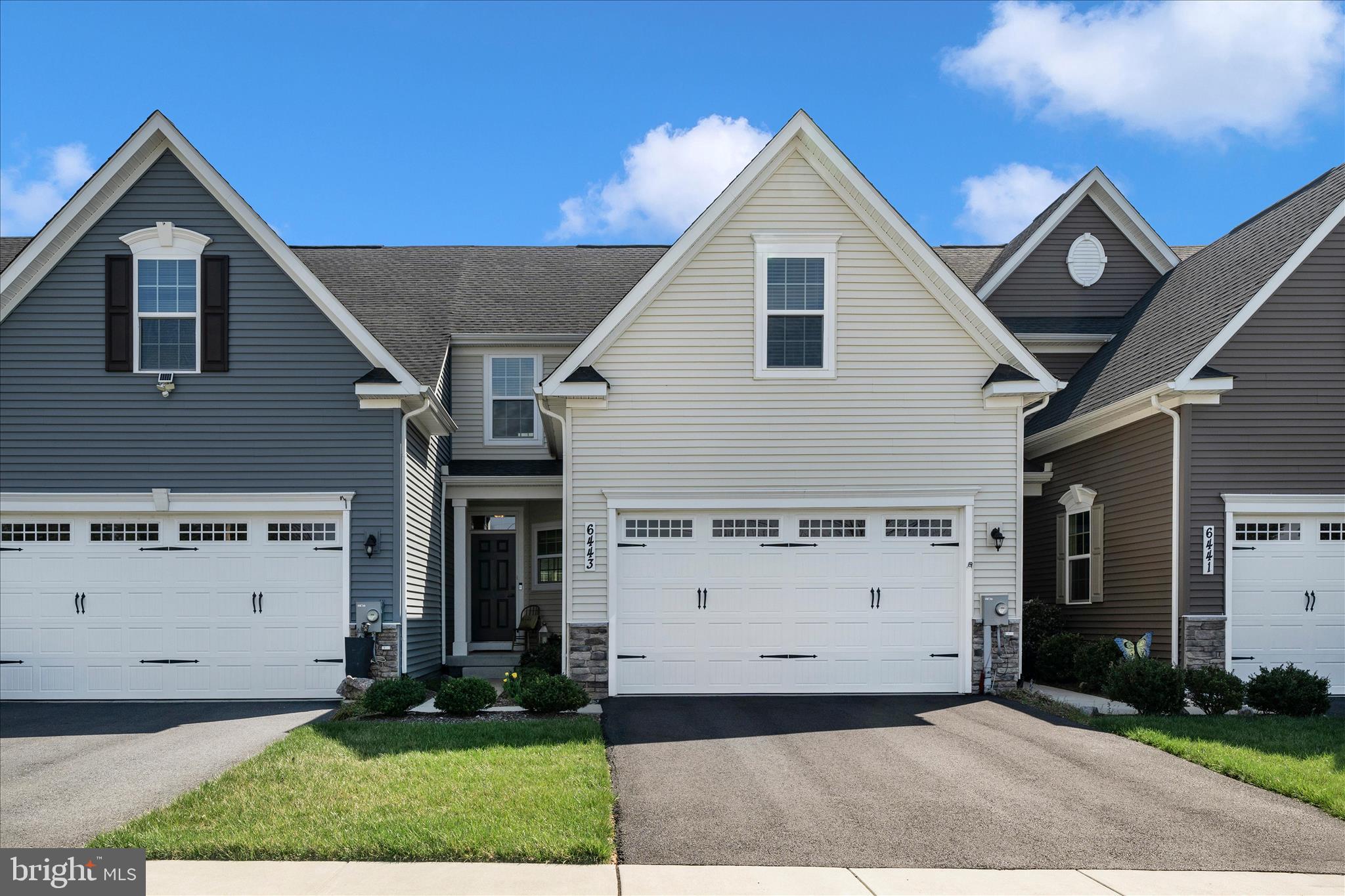 Welcome to 6443 Autumn Olive Drive—an exceptional opportunity in the desirable 55+ section of Ballenger Run, designed for easy, low-maintenance living. This lightly lived-in home is move-in ready and offers the perfect blend of comfort, style, and convenience.
The stunning kitchen is a standout feature, showcasing white soft-close cabinetry, quartz countertops, a modern backsplash, gas cooking, and stainless steel appliances. Just off the kitchen, you’ll find a convenient laundry room, powder room, and direct access to the attached two-car garage, complete with an electric vehicle charger.
The main living area features neutral luxury vinyl plank flooring and offers ample space for both dining and relaxing. Step outside to enjoy easy access to your private patio and fenced backyard—perfect for quiet mornings or entertaining guests.
The main-level primary suite is filled with natural light and includes a spacious walk-in closet and a beautifully appointed ensuite bath with double sinks, ceramic tile flooring, and an oversized tiled shower. The two additional upstairs bedrooms and a well-appointed full bath provide comfortable accommodations for guests or family. 
The finished lower level expands your living space with endless possibilities—ideal for a recreation room, home theater, fitness area, or office. There’s also an unfinished area perfect for storage or future customization, along with a rough-in for a full bath.
Located in the vibrant Ballenger Run community, residents enjoy access to a community center, resort-style pool, walking trails, and playgrounds.
Schedule your private tour today and experience the ease and elegance of this beautiful home!