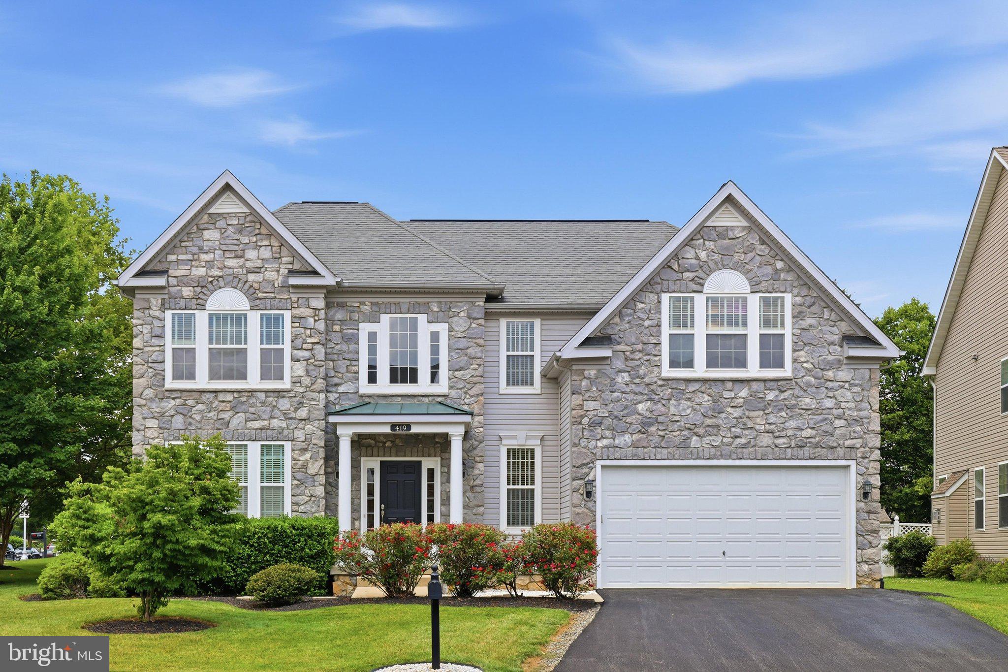Charming 4BR, 3.5BA Stone-Front Colonial in Desirable Rivercrest II – Frederick, MD. Located on a premium corner lot, this beautifully maintained Colonial offers classic curb appeal and a spacious, functional layout perfect for modern living. The main level welcomes you with a dramatic two-story foyer and flows effortlessly into a formal living room and separate dining room. The heart of the home is the warm and inviting kitchen featuring a center island, gas stove, and casual table space that opens directly to a cozy family room with a gas fireplace — ideal for both everyday living and entertaining. Additional main-level highlights include hardwood floors, a convenient powder room, main-level laundry room, and direct access to the attached 2-car garage and finished basement. Upstairs, the primary suite is truly impressive, complete with a private seating area, oversized walk-in closet, and a luxurious bathroom featuring a separate water closet and shower. Three additional generously sized bedrooms and a full hall bathroom complete the upper level. The fully finished basement offers excellent additional living space, perfect for a recreation room, home theater, or play area. It also includes a full bathroom, ample storage, a 60+ gallon gas water heater, heating system humidifier, and a reliable double battery backup system for the sump pump. This home is perfectly situated with easy access to major highways, top-rated local schools, Downtown Frederick, Carroll Creek Park events, shopping, dining, and scenic walking trails. Ready to make this your new home? Contact us today for a private showing!