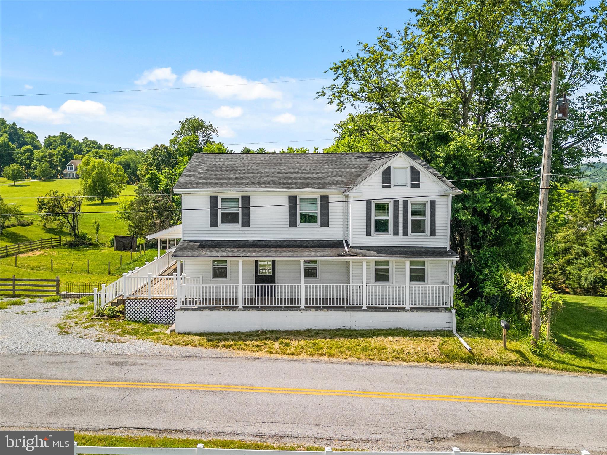 Welcome to this peaceful farmhouse on a picturesque half-acre lot in the serene countryside of Rohrersville, where charm, space, and endless potential come together! This home is priced to reflect cosmetic improvements needed to the paint, flooring, bathrooms and carpet. It also reflects exterior issues that need to be addressed to include siding, soffits and trim(not limited to). Dampness noted in basement during recent appraisal for 372k! This is priced below appraised value for quick and AS IS sale. This home will very likely require lender required repairs which is why it is priced to reflect AFTER REPAIR VALUE of OVER 400k!  This 5-bedroom, 3-full-bath home features a fantastic layout with a main-level bedroom and full bath, a dedicated home office with a shelved closet just off the dining room, and a bonus den perfect for whatever life demands. The updated kitchen and bathrooms give the home a warm and modern farmhouse feel, with major systems including the roof, appliances, HVAC, windows, and well pump all upgraded within the last five years - offering true peace of mind. Step outside and discover what makes this property truly special--established livestock pens, a charming roadside farm stand, and wide-open space ready to support your vision, whether that's a homestead, hobby farm, or small-scale agricultural venture. The possibilities here are genuinely limitless  so don't miss your chance to make this one your own. The sweat equity potential is tremendous here.