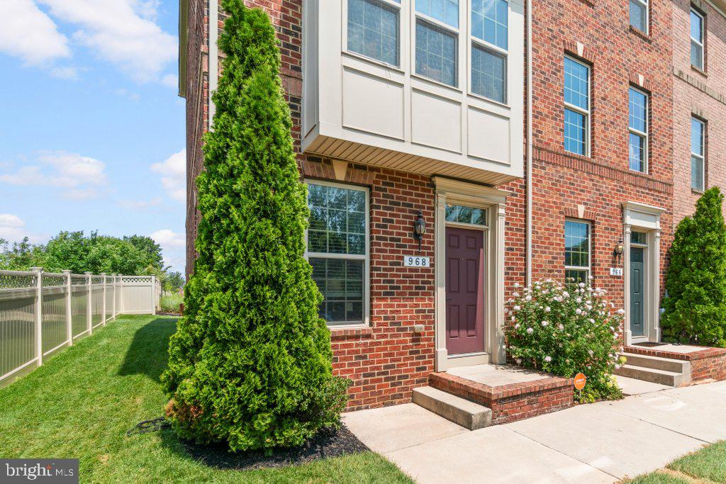 Well-maintained end-of-group townhome in O’Donnell Square offering 2 bedrooms, 2.5 baths, and three levels of comfortable living space. Built in 2015, this contemporary brick townhome features a bright, open layout with tall ceilings, large windows, neutral finishes, added end-unit privacy, and beautiful skyline views.

The entry level offers a welcoming foyer, two closets including a walk-in closet, and access to the attached rear-entry garage. The main living level features an inviting living room with abundant natural light, wood-style flooring, recessed lighting, and an open flow to the dining area and kitchen. The kitchen includes granite countertops, dark cabinetry, stainless steel appliances, breakfast bar seating, pendant lighting, and access to the rear deck. A convenient half bath is also located on the main living level.

Upstairs, the third level includes two spacious bedrooms, two full baths, and laundry conveniently located near the bedrooms. The primary suite features vaulted ceilings, generous windows, and a private bath. The additional bedroom and full hall bath provide flexible space for guests, work, or everyday living.

As an end-unit, the home offers added outdoor space, enhanced privacy, and impressive panoramic views of Baltimore’s skyline, including the iconic Natty Boh Tower. Exterior highlights include a rear deck, covered parking area, and off-street garage parking.

Enjoy the best of both worlds — vibrant city living in a neighborhood setting, with modern comfort, convenient parking, and easy access to nearby dining, shopping, commuter routes, and city amenities.