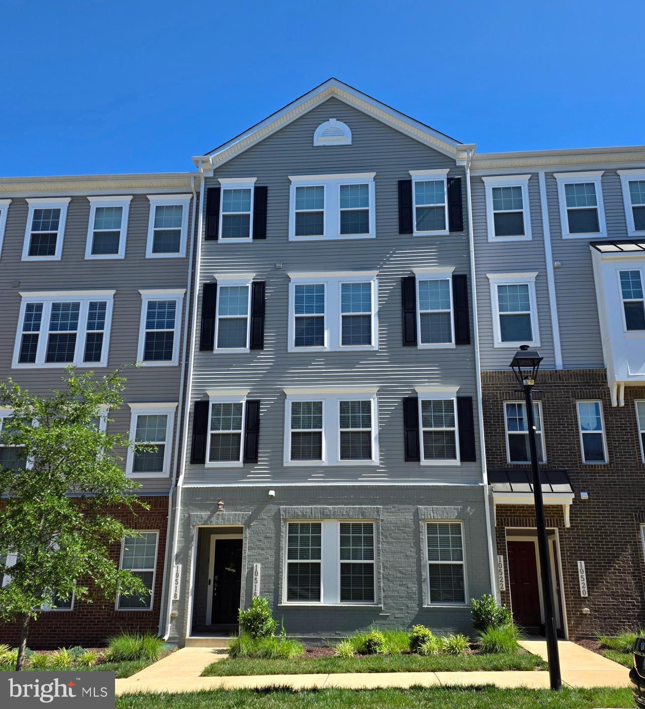 Welcome to this beautifully maintained upper-level luxury condo townhome in the prestigious and  sought-after Glenn Dale Commons community in Lanham, MD.  Built just 4 years ago, this spacious, sun filled, open concept two-level home offers 3 bedrooms, 2.5 baths. The artfully designed floorplan blends casual and formal spaces perfect for today's modern living and entertaining.  A welcoming foyer entry  is accessed from your front door or the garage, carries you up the sweeping staircase to the roomy Living Room with reading/desk area & glass doors opening to deck. The gorgeous gourmet kitchen offers premium stainless appliances,  an abundance of white cabinetry, a large center island with seating for 6, pantry and storage closet, Let's not forget the Dining Room perfect for family and holiday dinners.  The sumptuous  owner’s suite boasts a  huge walk-in closet, a private en-suite bath with makeup area and glass enclosed shower with bench. There are 2  additional family size bedrooms and a 2nd hall tub bath. Completing the private quarters is the bedroom  level washer and dryer! The additional features include recessed lighting, ceiling fans, blinds, window treatments, deck and garage with auto opener, plus driveway for an additional parking. The community amenities include a Gazebo with beautifully landscaped gardens, multiple sitting areas, walking trails, dog park, and lush common areas. Ideally located close to NASA, U. Maryland, and USDA, dining and shopping, this home offers easy access to I-495, Route 50, Metro/Marc Train, and major commuter routes to Washington, DC, Baltimore, and Northern Virginia. Minutes to I-495, I-95, 295.  There is no better location and location, location and location is everything.  The seller's transfer is your gain!!! Move-in ready!! Hurry, hurry schedule the showing of your new home today!!!