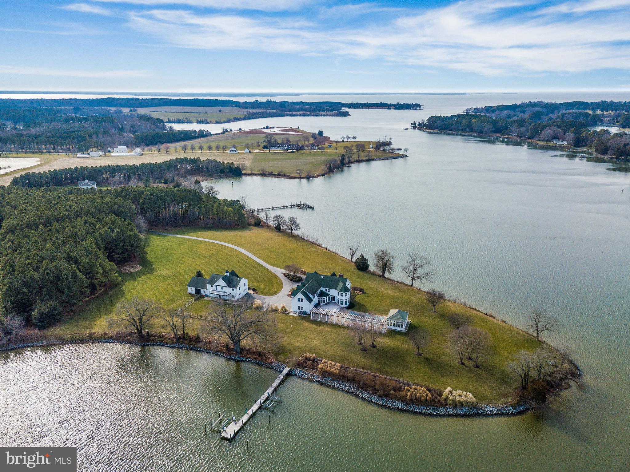 Welcome to Island Creek Farm.  As you pull up the private tree lined driveway you will see over 8 acres of trees and manicured landscape.  You will be in awe as you approach both the main house and the separate dwelling that includes a two car garage / workshop, boat storage and an incredibly charming and spacious 2 bedroom 1 bath private guest sanctuary.  Allow yourself to take in the 270 degrees of water frontage and 1,400 ft of shoreline as you take yourself around to the back of the house where you will find your waterfront swimming pool.  This added luxury is fully equipped with a pool house, extensive hardscape, and a large composite deck perfect for creekside entertaining.  The recently updated  pier includes 2 power boat lifts, plenty of room for overnight guest docking, and water depth deep enough to accommodate just about any sized vessel you may have or wish to purchase.  

Main house overlooks Island Creek with Western Exposure where sunsets can be seen from nearly every room in the house.  With 4 bedrooms / 3 full bath / 2 half baths, there is plenty of room for entertaining guests each season of the year.  The main house also includes: hardwood floors throughout, separate living room, sunroom, study, dining room, office, bonus room, and full unfinished lower level.  For buyers looking for even more guest space, the separate apartment over the detached  garage is the perfect place to spread out, relax and take in the views from every room or from one of two decks facing the water.

Schedule your tour today to see this truly one of a kind property!