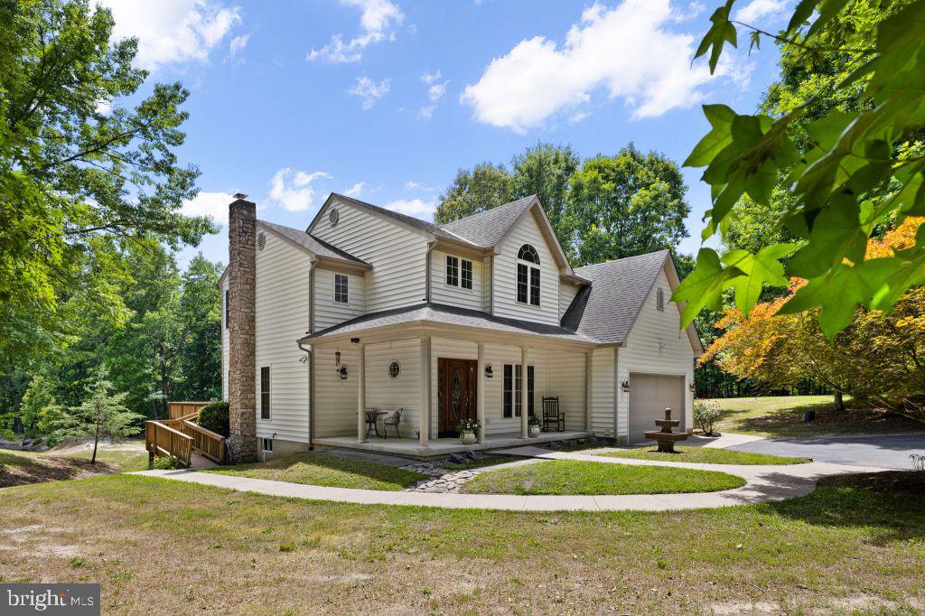 Unbelievable opportunity to hunt/fish/live on 24.98 acres of your own sanctuary of privacy just minutes from EVERYTHING! This 4BR/2.5BA Colonial boasts a private gate, circular drive greets you as you park and enjoy your pond and views. Acres of trees with paths, marsh and river! Gorgeous walnut plank wood flooring on lower level. Well equipped kitchen w/ granite & SS appliances. Too much to list. . High end finishes. Stainless appliances, Thermador ovens (2) and cooktop. 24.98 acres. 5 acres fenced in. 1 1/2 acre pond. 24 ft double entry gates. pier in fishing pond, large 1yr old decking.