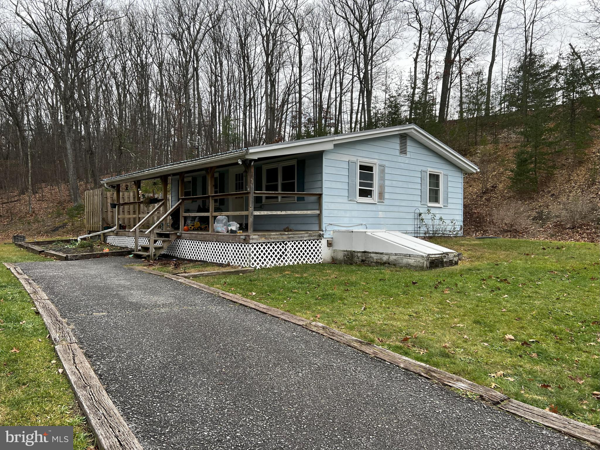 Nice 2bd rancher with full basement and fireplace, on 2ac lot with 2huge out buildings/garages with electric. property is partially fenced and very private, but in great proximity to Berkely medical center.  This is property is priced to sell do not hesitate on this rare opportunity.