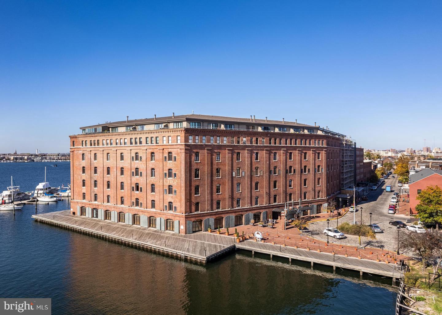 You will love this 2 story "loft" unit with recent updates at The Inn at Henderson's Wharf. Located on the water in the heart of Historic Fells Point. This home offers a combination living room dining room. The kitchen features black appliances appliances and a breakfast bar. Freshly painted.   Henderson's Wharf offers exclusive parking and this unit comes with One garage parking space in the secured attached garage. This historic sought-after Complex offers a 24-hour front desk and concierge service, elevators and a fitness center. Just a short stroll away is the Henderson's Wharf Marina and dozens of restaurants, bars and shopping. You can moor your boat at the Marina at Henderson's Wharf. This full-service, deep water port has 256 slips and luxury amenities. This is City Living at its VERY BEST!