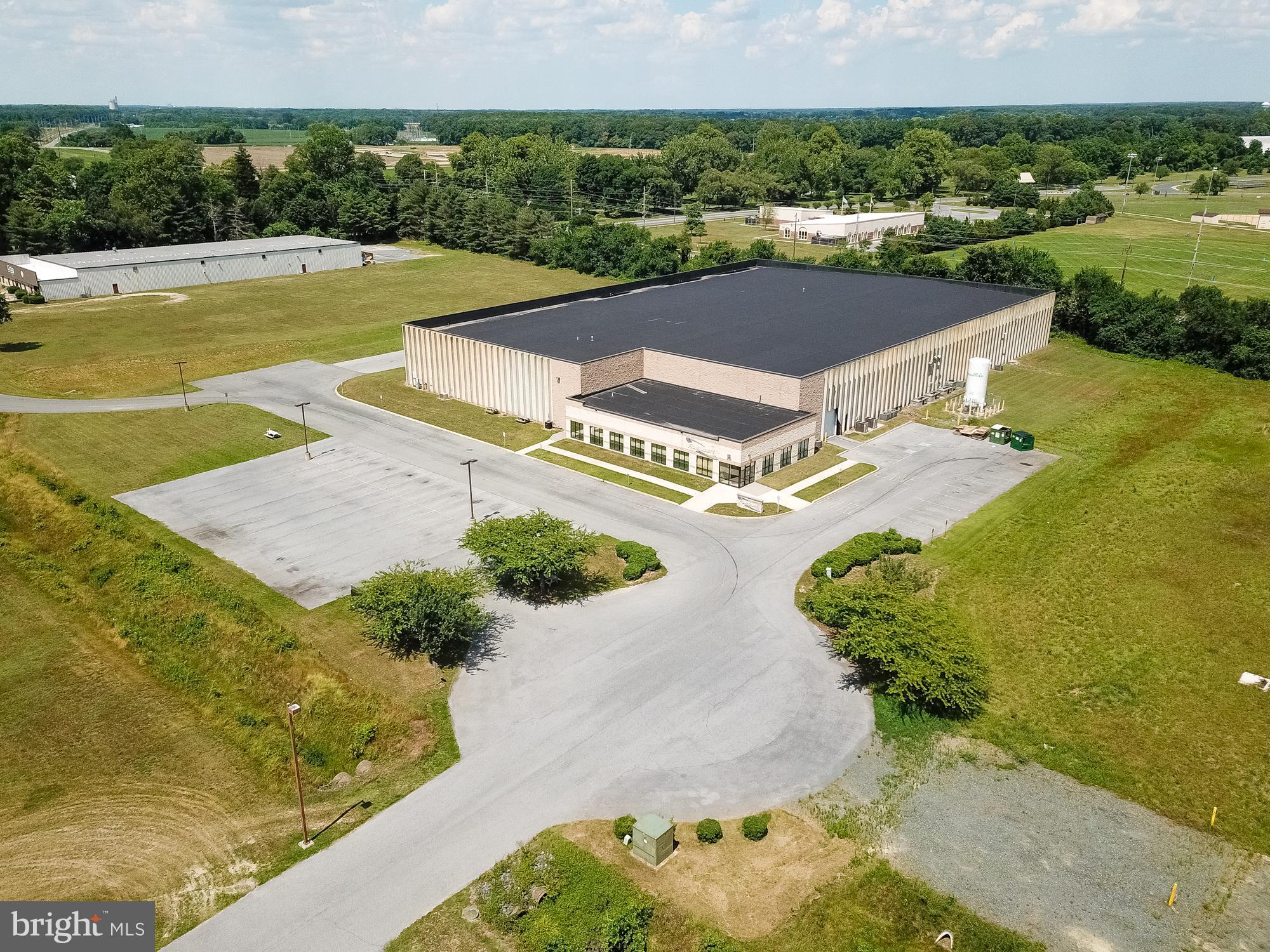 Manufacturing Facility for Sale or Lease.
60,000 square feet total - 22,500 SF of fully conditioned manufacturing space ( clean rooms and all support systems are remaining in place. Two rooms are full-fledged clean rooms, and one room is a white room).  5,271 SF of very attractive office space offering executive offices, administrative areas, bull pen area, conference room and cafeteria.  17,699 SF heated warehouse space.  30' ceilings.    Fully sprinklered - Heavy electrical power.  Large breakroom with lockers and multiple restrooms.  
3,500 SF of open mezzanine space.  Public utilities - 2 Docks - 1 Drive-in.  Great parking for employees and tractor trailers.
City of Seaford is the electrical provider.  Owner would like to leaseback 14,500 SF of warehouse space.