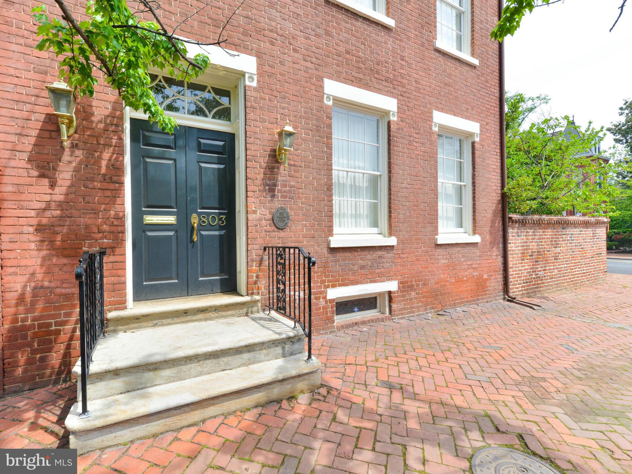Rare opportunity to own a piece of Alexandria history. Built in 1810 by a wealthy ship captain this elegant property is zoned for commercial/ residential. 10 ft ceilings, original Pine floors, brick walled garden, one block to King Street. Endless possibilities for remarkable property! ENORMOUS GARDEN.Walkable to King St. Metro,1 blK to trolley. Photos from earlier staging. Covered parking avail.