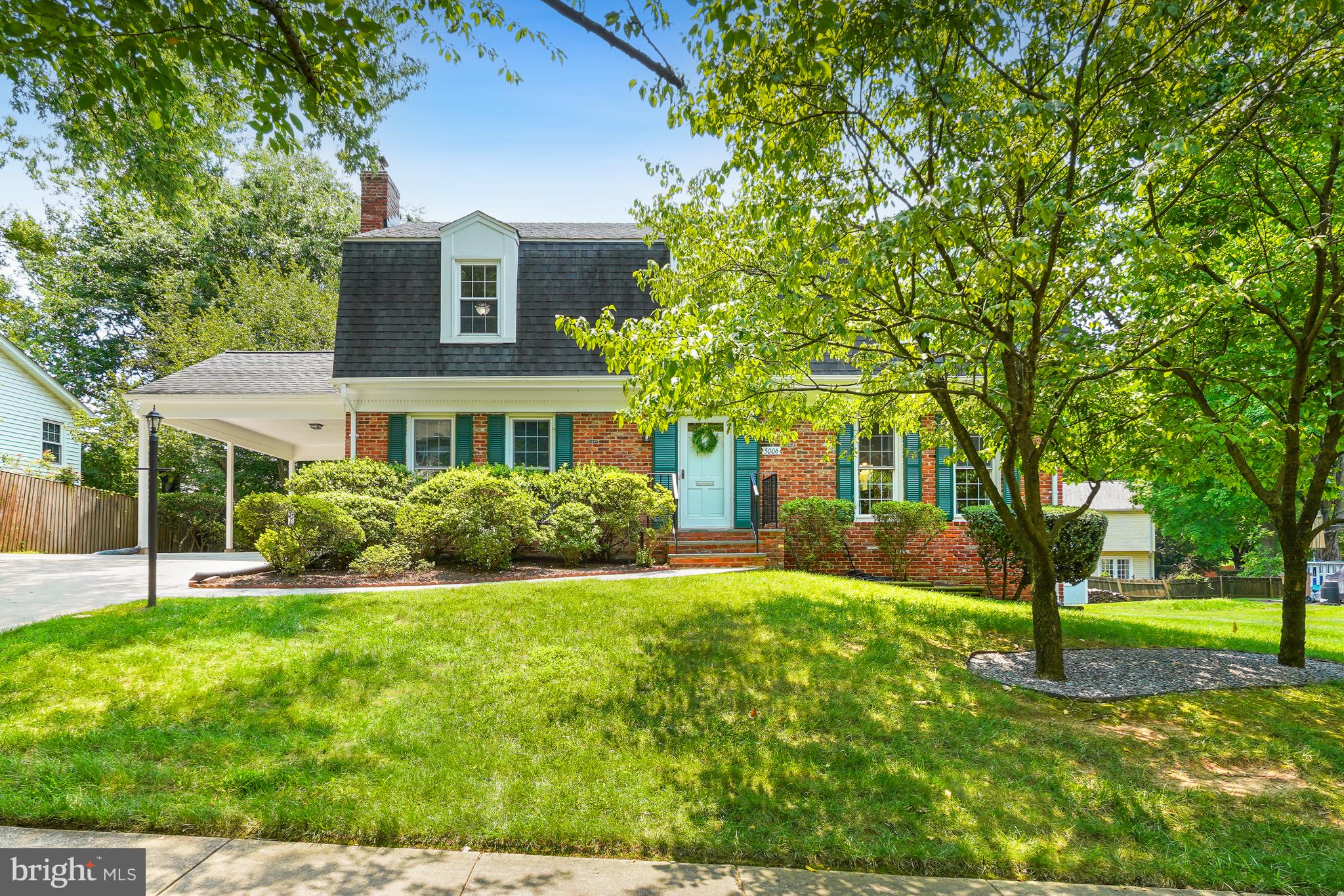 A Stately & Elegant Center Hall Colonial Home. This charming Center Hall Colonial features a timeless floor plan designed for comfortable living and graceful entertaining. The welcoming foyer opens to spacious living and dining rooms, which lead to a private deck overlooking the beautifully landscaped backyard with panoramic views. The inviting family room reveals a cozy fireplace and large windows that fill the space with natural lighting and landscapes. The foyer also encourages a seamless flow into the kitchen with adjoining breakfast room perfect for everyday living and casual dining. Solid white oak hardwood floors refinished with a natural luster add warmth, timeless elegance, and a striking glow throughout. The upper level provides a front to back primary suite with sitting room, perfect for relaxation. Three additional bedrooms are bright and spacious. Two 14" Solartubes were installed in the hallway over the stairwell for additional natural light and each has rechargeable batteries so that on sunny days the upstairs hallway has a 'night light'. You can walk-out from the main and lower levels which reveal a beautifully landscaped yard with impressive hardscape creating a private outdoor retreat from the deck and the newly installed patios. Walk to the popular Manor Woods Community Pool, Rock Creek Shopping Center with fantastic restaurants and Lucy Barnsley Elementary, and Earl Wood Middle Schools. Take a short drive to Rockville High School. Conveniently Located Near Metro, Rock Creek Park with Lake Frank which connects to Lake Needwood featuring boat docks and 30+ miles of hiking and bike paths from Rockville to Georgetown, Washington DC. Easy commuter routes to VA and Baltimore.