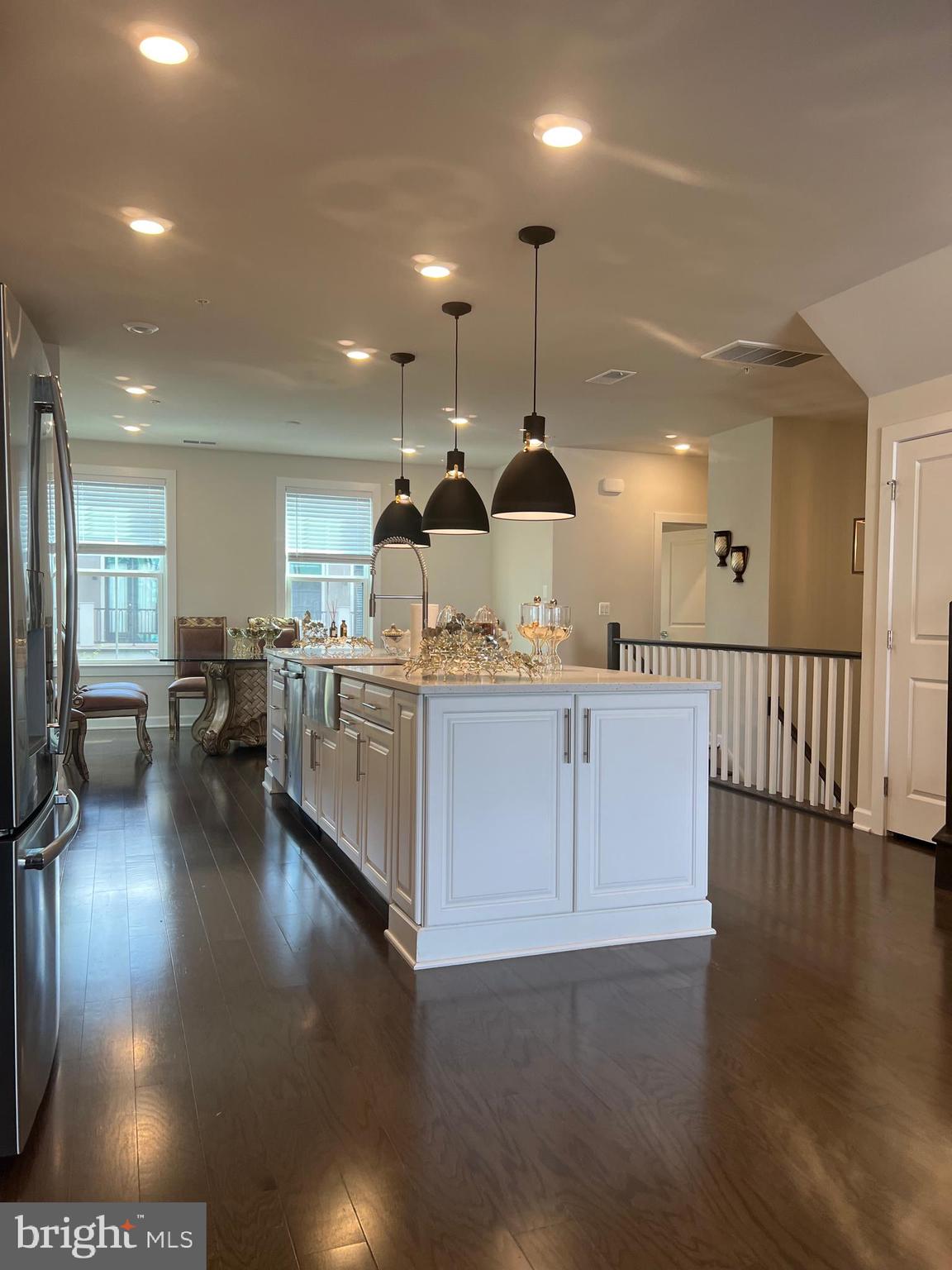 Fantastic location** This Two Story 3 Bedroom 2.5 Baths Townhouse Style Condo located in the heart of One Loudoun just a block to walkable shops, restaurants. Open floor plan has a beautiful contemporary gourmet kitchen with white quartz countertops island, white cabinets, and stainless steel appliances,   wall oven and microwave combo, kitchen pantry, covered deck with fireplace, large double sliding doors, Master bathroom with granite countertops, white cabinets, ceramic tiles,  shower doors, Washer and dryer on bedroom level,  garage and driveway parking. The One Loudoun upscale Community  offers, a clubhouse, swimming pool, tennis courts and so much more. It is so close to all your favorite restaurants, Alamo Cinema, Trader Joes, Farmers Market, seasonal live music, stores, cafes and more- you'll find it all in this upgraded luxurious unit at Downtown One Loudoun!