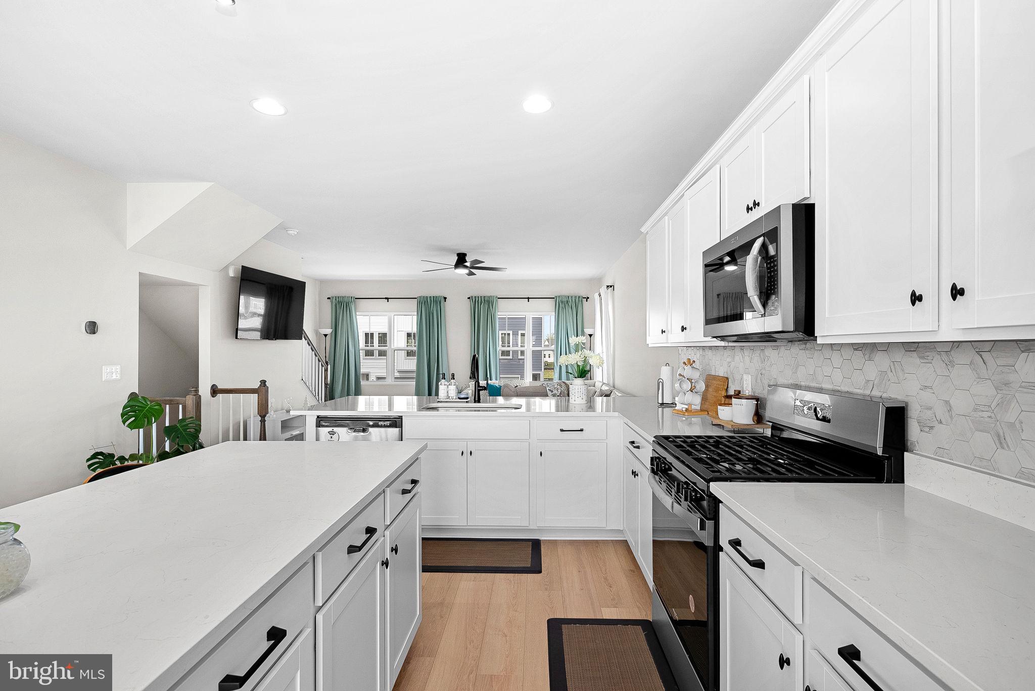 Bright and open 4-bedroom end-unit townhome with exceptional community amenities, nestled just outside of the Blue Ridge Mountains! Luxury vinyl plank flooring flows throughout all three levels. The gourmet kitchen is the heart of the home, featuring white Corian countertops, an oversized island with ample seating, gas cooking, a deep sink, stainless steel appliances, a pantry, and a separate breakfast area with mountain views. The open layout flows seamlessly into a sun-filled family room with large windows and a ceiling fan.
Upstairs, the spacious primary suite features a walk-in closet and a spa-like en suite bath with a soaking tub, separate shower, and dual sinks. Two additional bedrooms, a full hall bath, and convenient upper-level laundry complete the bedroom level. The walk-out lower level offers a 4th bedroom or versatile recreation space, along with a half bath, closet, and storage. The home also includes a one-car garage with opener.
Located in an amenity-rich community offering a 15,000 sq. ft. indoor sportsplex, private splash park, bike track, swimming pool, picnic pavilion, trails, dog park, on-site elementary school, and day care center. With its captivating views, convenient location, and hometown feel, Stephenson is the perfect place to call home. Enjoy a variety of outdoor activities nearby, including scenic hiking trails in Shenandoah National Park and picturesque drives along Skyline Drive. Situated just minutes from major commuter routes, shopping centers, and Downtown Winchester, this area offers the perfect blend of convenience and tranquility. Explore local restaurants, historic landmarks, and unique shops in Downtown Winchester, with easy access to I-66 and I-81 for commuting toward Northern Virginia and Washington, D.C. A wonderful home with space, comfort, and lifestyle amenities all in one!