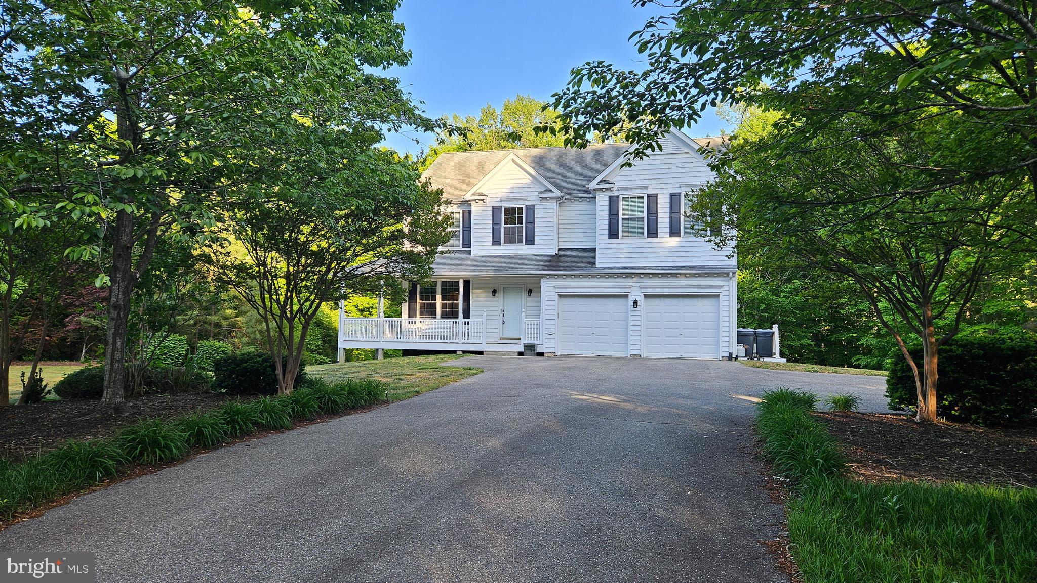Large price adjustment!  Prime opportunity to obtain a home in which to grow.  The room sizes are generous and the basement has been laid out to be finished into a XL recreation room, bedroom and full bath (rough-in).  The primary suite is expansive and features 2 walk-in closets, a large bathroom with dual vanities, soaking tub, separate shower and a picture window framing the lush, green back yard.  The kitchen features Kraftmaid cabinets and an open concept with a large table space surrounded by windows and walk-in pantry.  The kitchen is open to the family room which has a gas fireplace and custom book shelves.  There are hardwood floors, plentiful, high quality windows, a 2 car garage and an abundance of outdoor spaces ( covered front porch and 2 rear decks).  The lot could not be nicer!  It allows for a full walk-out basement with large windows and French doors.  There is a wooded view from the front and the rear which creates serene views and maximum privacy.  The community amenities include a basketball court, playground/tot lot, baseball field, and tennis courts (projected to be upgraded with pickleball courts).