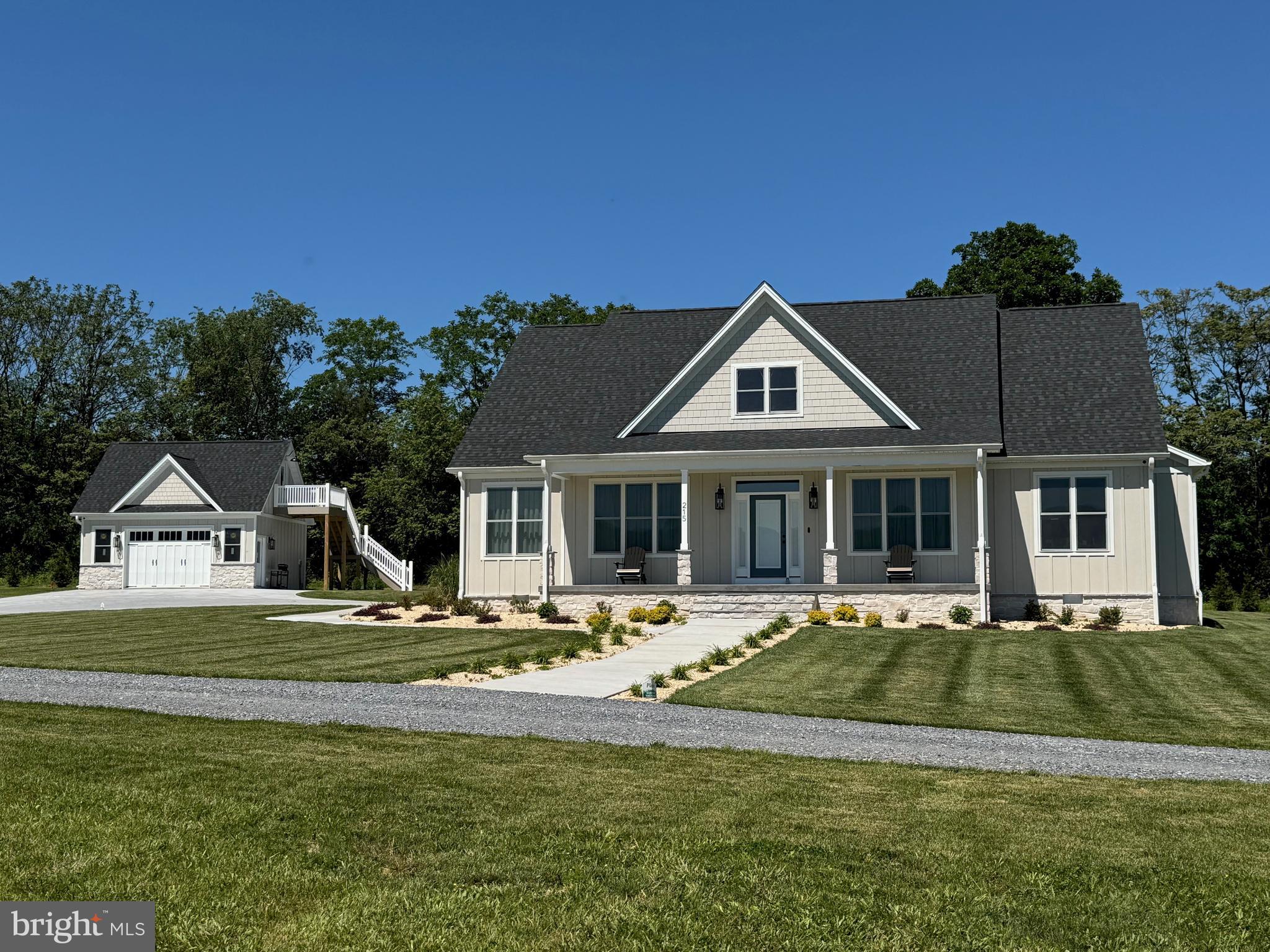 PANORAMIC BLUE RIDGE VIEWS -  Experience refined country living in this beautifully crafted 2025 modern farmhouse set on 8+ acres of pasture in Virginia's breathtaking Shenandoah Valley. Designed for effortless single-level living , this exceptional home blends timeless farmhouse charm with high-performance construction and contemporary luxury. Step inside to a bright, open-concept layout  filled with natural light and seamless indoor-outdoor flow. Wide COREtec cork plank flooring runs throughout, delivering warmth, comfort, sound insulation and waterproof durability. The inviting living area is anchored by a stone-faced electric fireplace, creating a warm yet sophisticated focal point.  The chef's kitchen is a true showpiece featuring  custom KraftMaid cabinetry, premium Cafe appliances, expansive Cambria quartz countertops, a striking Zellige tile backsplash, and oversized quartz island ideal for gathering and entertaining, and a spacious walk-in pantry offering abundant storage and organization. Bedrooms include a serene primary suite with spa-inspired bath. An additional 1.5 bathrooms provide comfort and convenience for family and guests.  Enjoy both covered front and rear verandas- perfect for peaceful mornings, shaded afternoons, and unforgettable sunsets overlooking open fields and sweeping mountain views.Built with exceptional attention to detail and performance, this home was engineered for efficiency, longevity, and superior indoor air quality. Features include: attached 2 car garage, detached 24X20 garage with loft - ideal for studio, office, gym or storage & a basement room perfect for wine storage . Fully conditioned 48 " crawl space, climate-controlled attic with ERV ventilation and spray foam insulation, high-performance HVAC with IQ Air whole-house air purification system, Pella windows with SUNDEFENSE UV protection ,  exterior board & batten Hardie Board siding, whole-house water softener , kitchen water purifier, under-cabinet lighting, rock base exterior accents, and color-changing eave lighting.  Outside, panoramic Blue Ridge Mountain views stretch across open fields and endless skies, A private pond enhances the peaceful setting adding natural beauty and character to the landscape. The gently rolling acreage offers endless possibilities- horses, livestock, hobby farming, gardens, recreation, or simply wide-open privacy- all framed by unobstructed mountain vistas. Located just minutes from Shenandoah National Park, Historic Luray Caverns, hiking, fishing , and charming small town amenities, this property offers privacy without isolation.  SCHEDULE YOUR PRIVATE TOUR TODAY - RARE OPPORTUNITIES LIKE THIS DO NOT LAST!