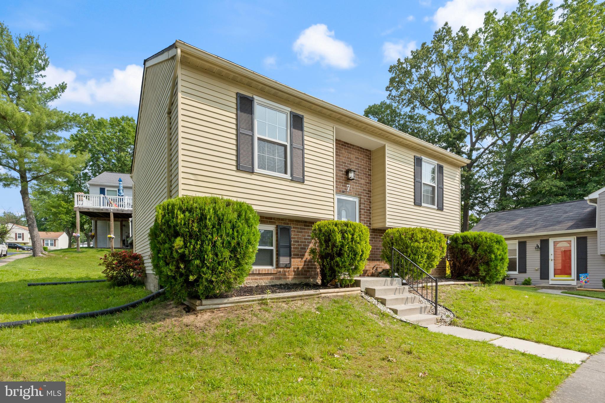 Beautifully renovated 3BR/2BA split foyer Ranch located on a corner lot in the quiet neighborhood of Perry Hall. Ample parking is just steps from the front door into your forever home.  Step inside to a home filled with natural light, a neutral color palette, glamorous lighting fixtures, and stunning flooring.  The main floor offers a large living room, a spacious dining room, a new kitchen, three bedrooms, and a brand new full bath.  The kitchen features plenty of cabinets to the ceiling, stainless steel appliances, quartz countertops with a complimenting tiled backsplash, and a stainless sink.  The lower level offers additional living space featuring above grade windows, a full bath with a walk-in shower and a double sink vanity, a possible 4th bedroom or home office, space for the family to enjoy, laundry, storage, and a walk-out to the yard.  From the sliding doors on the main floor, step outside onto a large deck that overlooks the yard offering so many possibilities.  This home is move-in ready with so much to offer new homeowners, and is located in close proximity to shopping, restaurants, and commuter routes.