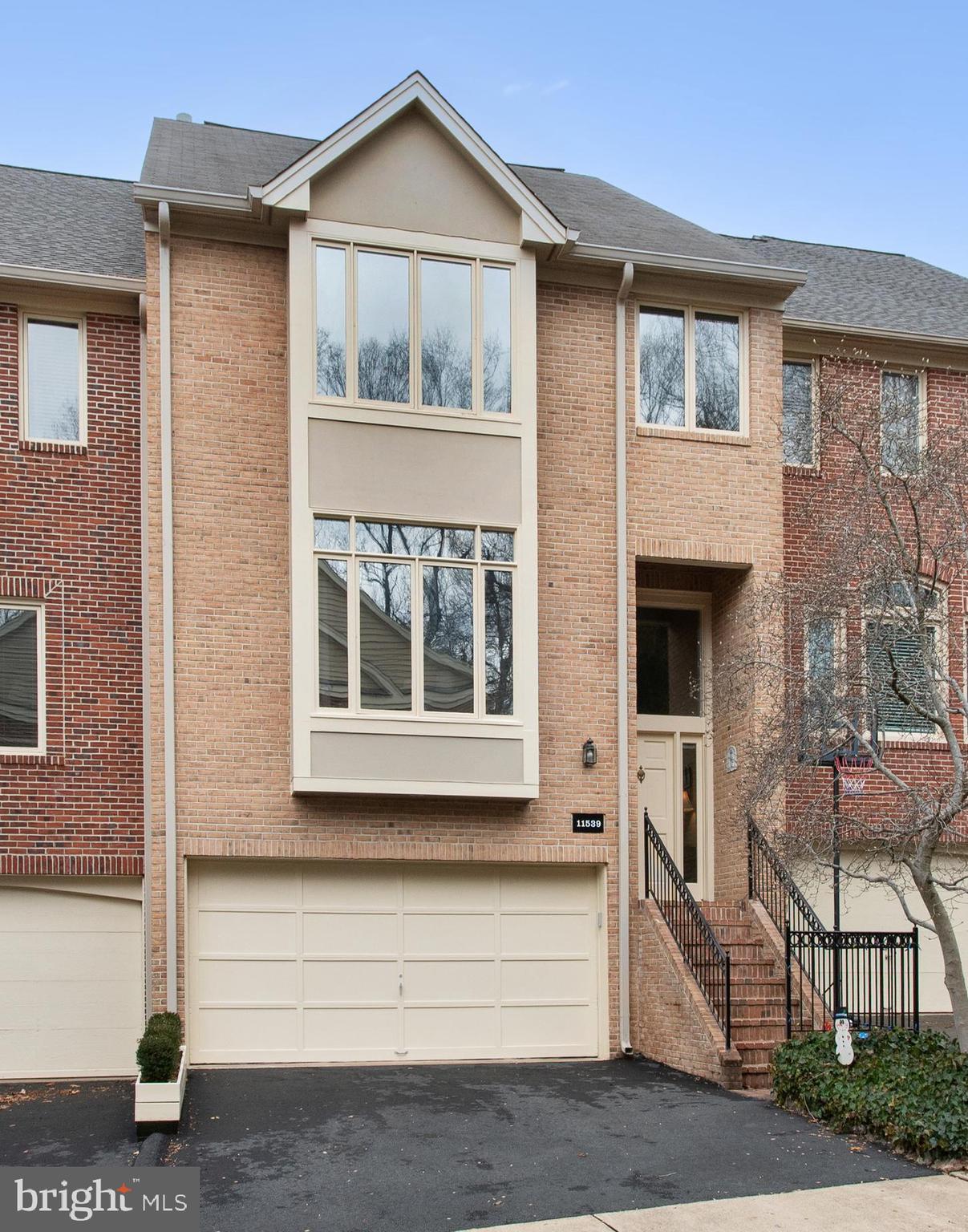 Built by Wrenn, this townhome with over 2500 sq ft, lives like a single family home.  It features generous rooms sizes, 9 ft ceilings, large closets and oversized windows - allowing for so much natural light.  This well maintained home is conveniently located in North Reston in a small cluster of homes off Lake Newport.  There are lake privileges in this community and a common dock located at the very end of Hemingway Drive.  Some recent improvements include Kitchen appliances, updated Master Bath, HVAC replacement (2021) and a Trex deck.  The main level features a large Living Room attached to a huge formal Dining Room with a full wall of custom built-ins and a two-sided fireplace.  Past the formal area is a separate Family Room which opens to the Kitchen featuring a floating island and a walk-in pantry.  Both these rooms have easy access to the private Trex deck.  The entire main level is hardwood flooring.  Upstairs there are three very large Bedrooms, a Loft which can function as  a small Office,  and a large Laundry Room for convenience. The Primary Bath is  spa-like with a soaking jetted tub, heated flooring and a separate shower - recently redone. The lower level is a walkout with additional windows and a French door and includes a Rec Room, 4th Bedroom and  3rd full bath.  There is access to the garage from this level in addition to a door that takes you to a lower level slate patio.  The current cluster fee pays for the mowing of the yard, maintenance of the cluster common area (including the dock), trash, recycling and snow removal.  The Reston Association fee of $817/year allows Owners access to all the Reston amenities, including 55 miles of paved trails/pathways, numerous pools, tennis courts, playgrounds and the Community Center.  This location at the corner of Center Harbor and North Village has great walkability to the Reston North Village shopping center, schools, pools and parks.  There is also quick access to the two Reston Metro Stations, the Dulles Toll Road, Dulles Airport, Rt 7 and the Fairfax County Parkway!!