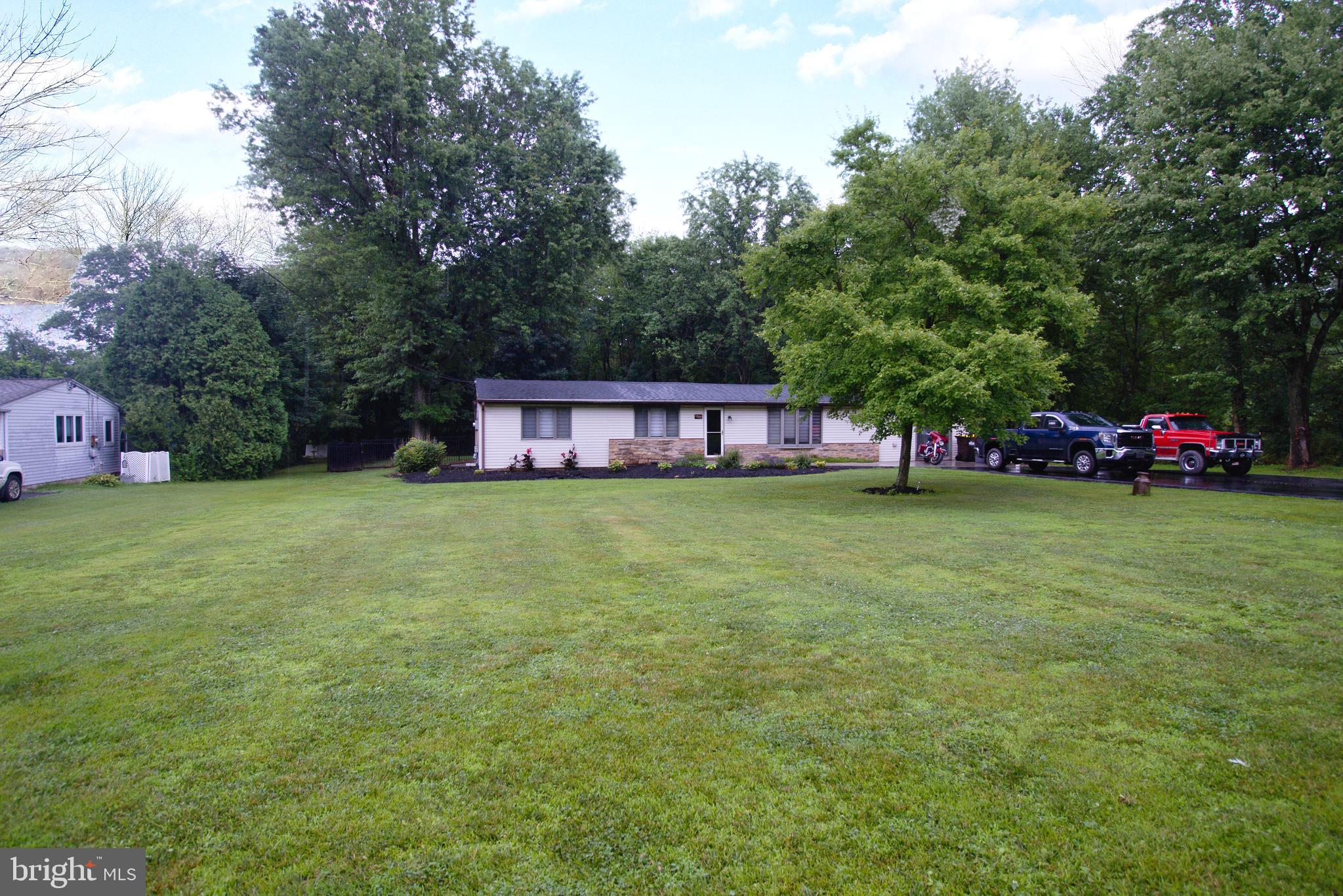 Single Ranch home with 4 bedrooms, 2 full baths.  High Efficiency heating system,  3 year old roof, 2 year old  concrete walk way to the front door.  Central Air, gas fireplace in the Living room and gas free standing stove in the family room.  Eat in kitchen with dishwasher, trash compactor, gas cooking, recessed lighting, built in microwave, and sliding doors to the covered deck and rear yard.  Master bedroom with walk in closet and full bathroom.  Three additional bedrooms or use the back room as an exercise room, office or craft room.  Great fenced in yard with an above ground pool and extra large deck.  Passing Septic report just completed July 2026.