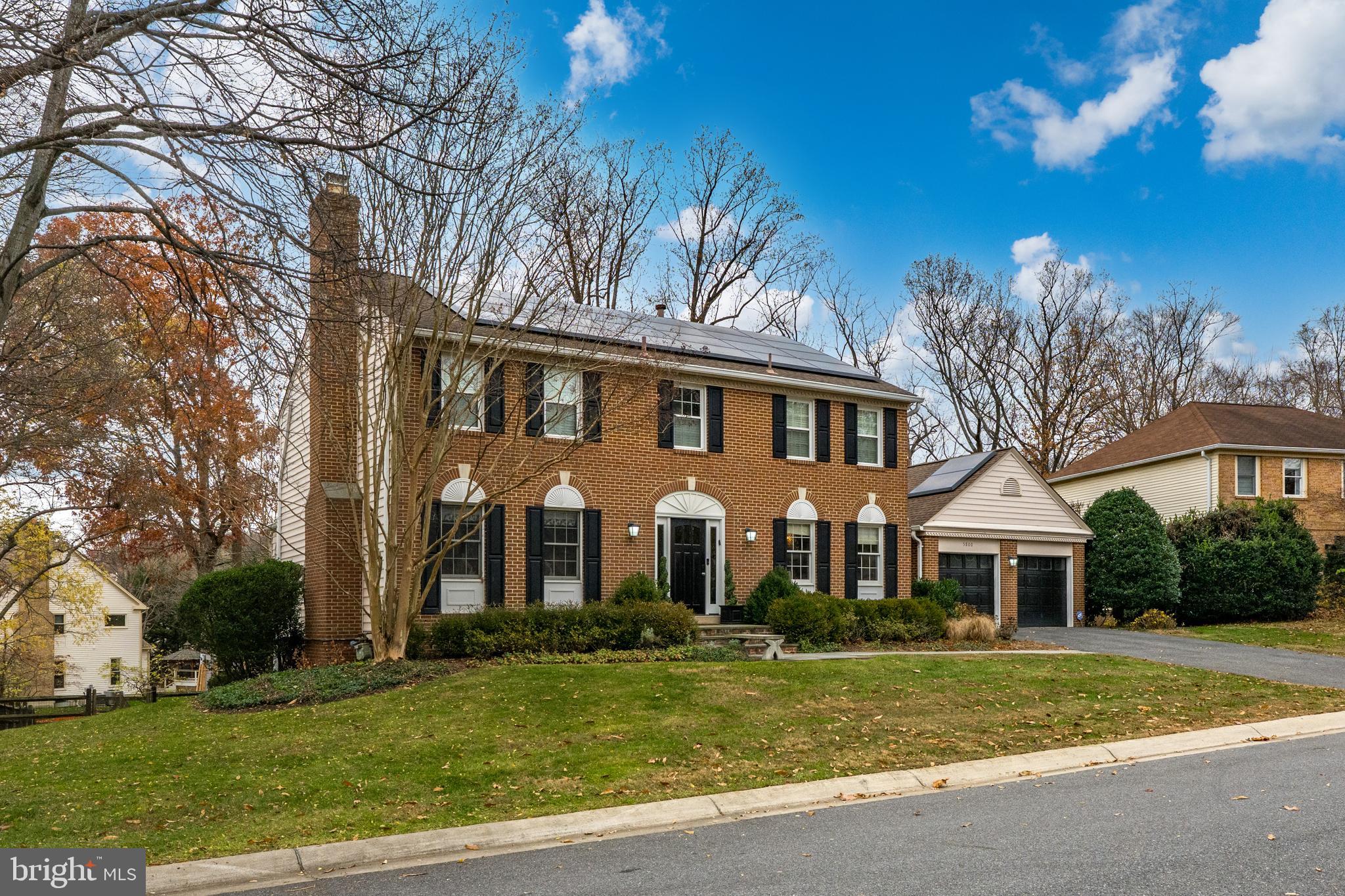 Welcome to 5800 Cartina Terrace, a beautifully renovated brick center-hall colonial in Timberlawn, quietly located at the corner of a cul-de-sac and non-thru street. Taken down to the studs, this 5BR/4.5BA home features hardwood floors on the main and upper levels, a living room with wood-burning fireplace, formal dining room, home office with built-ins, and a spacious kitchen with stainless steel appliances, gas range, wall oven, built-in microwave, wine refrigerator, and breakfast-bar seating open to the family room with stone fireplace. The screened-in porch with vaulted ceiling opens to a rear deck with a grilling station and refrigerator, plus a charming backyard gazebo. Upstairs offers four bedrooms and three baths, including a primary suite with fireplace and spa-like bath with double vanity, walk-in glass shower, and soaking tub. The finished lower level includes one large flexible space for recreation, media, and additional living, along with a fitness room with full-size windows, a fifth bedroom and full bath, and walk-out French doors to the rear yard. The home is equipped with solar panels that significantly reduce electric costs. Pool and tennis court access is available with optional membership access, and the location offers easy access to the Capital Crescent Trail system for walking, jogging, and biking. Attached two-car garage. Close to two Metro stations, Whole Foods, and the shopping and dining at Pike & Rose. Please note: Square footage is estimated and calculated by an independent third party; information is deemed accurate but not guaranteed.