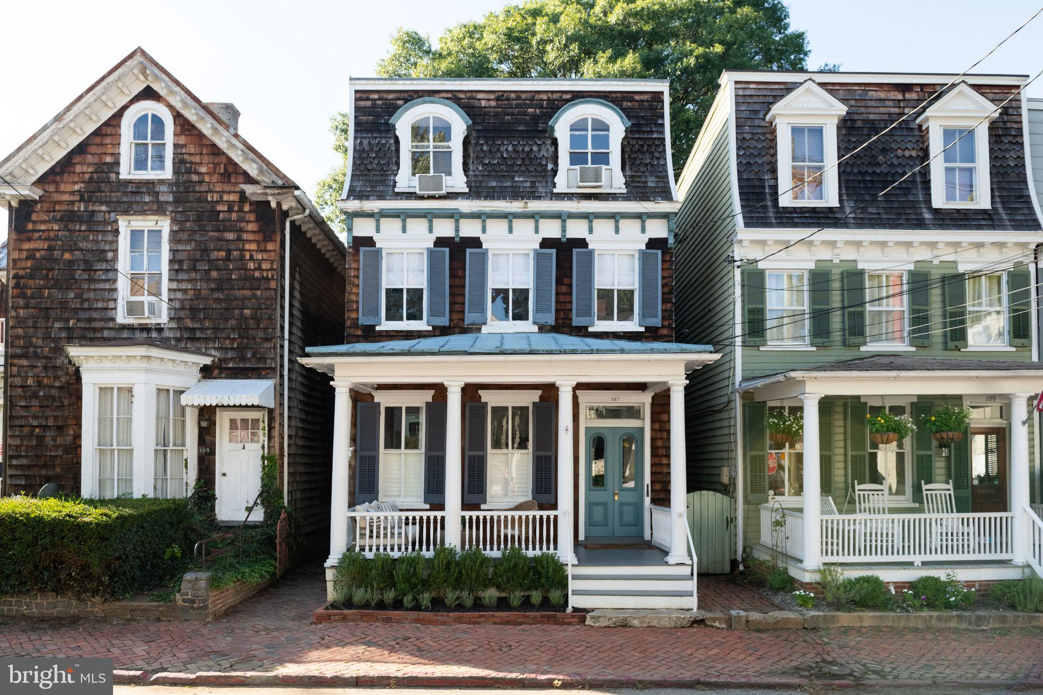 The historic Smith House is a charming 4-unit home in the heart of downtown Annapolis, steps from Main Street and in the city's most desirable area. The home is the perfect turnkey opportunity for owner-occupy, long-term, and short-term rentals. Units 2, 3 and 4 fully furnished and fully built business ready for immediate income. 
 
The property generates a remarkable annual income through its rented units, making it a profitable investment opportunity. It has been fully leased for the last ten years, with waiting lists for occupancy. Currently, three units are offered as a boutique Airbnb, receiving revenue in the top percentile compared to other Historic Downtown Annapolis properties. The apartments have received impeccable reviews and a Superhost status; you will not find a better ‘house-hacker’ opportunity. It is currently licensed through the city for both short and long-term renters.
 
The house has undergone significant renovations, including kitchens, baths, and flooring while holding true to the historic nature of this dwelling. Modern updates include glass shower enclosures, quartz countertops, floating shelves, recessed lighting, and Wi-Fi-enabled locks. These mix seamlessly with polished nickel fixtures, an original clawfoot tub, exposed brick, and restored original doors. In addition, it boasts a recently refinished standing metal seam roof, a new main water line and main sewer line, updated electrical, new gutters, and new plumbing in much of the home.
 
You and your tenants can experience the joys of being minutes from Main Street, City Dock, and the Naval Academy, with the best restaurants, shopping, and art galleries. Acton Cove Park is around the corner, and access to Spa Creek is at the bottom of the street. The Noah-Hillman garage is steps from the property, making it easy for overnight guests to park, and a water taxi stop allows them to explore Annapolis by boat. We welcome you to come visit and see what 107 Conduit has to offer!  Investment opportunities in Annapolis like this one don't come along often, don't hesitate!!!