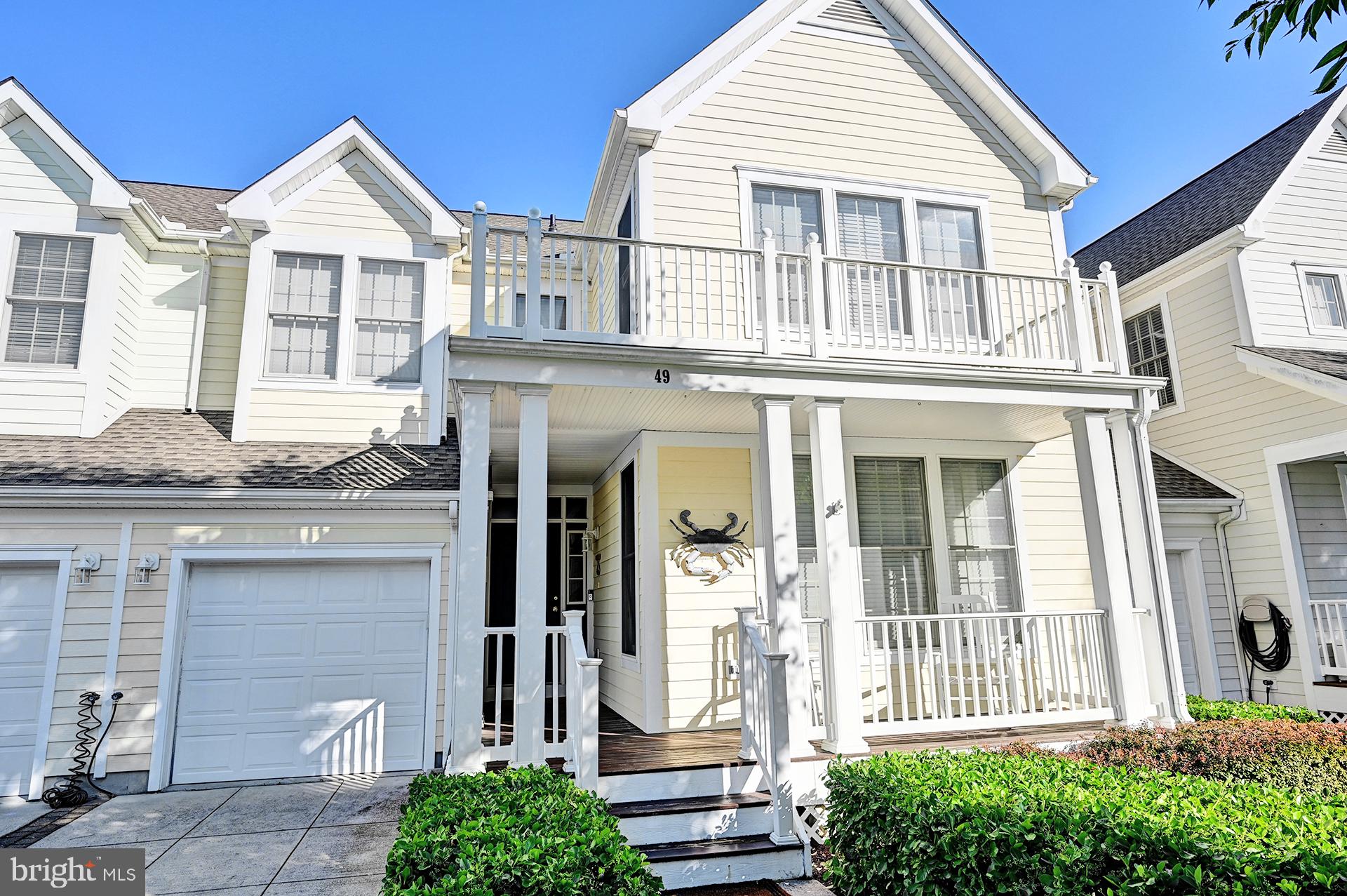 Discover the perfect blend of comfort and coastal living in this furnished townhome located in the desirable Bear Trap Dunes community. Bear Trap Dunes offers outstanding resort-style amenities, including indoor and outdoor pools, a fitness center, tennis, pickle ball, and basketball courts, a clubhouse, sauna, playgrounds, and optional golf membership. This meticulously maintained home features three spacious bedrooms and two and a half bathrooms, providing ample space for relaxation and entertainment. The contemporary design is complemented by high-quality finishes, including luxurious vinyl plank flooring throughout the living space and primary bedroom. The kitchen is equipped with new stainless steel appliances, including a built-in microwave, range, refrigerator and a newer dishwasher. Enjoy cozy evenings by the gas fireplace in the inviting living area, or step outside to your private deck (recently redone in Trex) or screened porch, both perfect for morning coffee or evening gatherings.  With an attached garage and additional driveway parking, you'll have plenty of storage. The home is equipped with modern security features, including an exterior ring camera, providing peace of mind. Experience the lifestyle you've always dreamed of in this exceptional property, where every detail has been thoughtfully designed for your enjoyment. Don't miss out on this incredible opportunity!