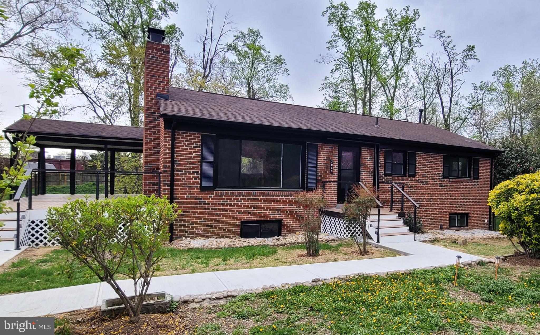 EXTERIOR YARD PICS TO BE UPLOADED***Truly a Must See!!! This Beautifully Renovated All Brick Single Family home has been Renovated Inside and Out on over a third of an acre!!**6 Bedrooms and 3 Full Baths set in an Open Floor plan with Custom Design throughout all levels**Front door leads you into an open living room, with a wood insert fireplace, surrounded by a custom wall of wood and invisible Led lighting that gives you that Special glow when turned on**Gourmet Kitchen with Waterfall High End Quartz Island and Countertops with the Waterfall Quartz cascading down the sides of the Solid Wood Cabinets, Stainless Steel Appliances, Custom door trim, and Crystal Pendant lights, that can dim from a low soft light, to high and bright LED***Matching Dining room lighting can also be controlled by the wall outlet, and remote**Walk out kitchen door to a Massive Custom Deck with Coverage to entertain in any weather**Custom Invisible LED lighting leads down the Hallway to the Master Bedroom with a Full Bathroom, 2 additional Bedrooms and a Hall Bathroom**Private Stairway leads up to attic, with flooring for extra storage**Follow the Staircase to the Lower Level with Custom LED lighting and Modern Design leading you to a very Spacious Recreation Room with a Beautiful view of the Rear Yard, 3 Bedrooms, a Laundry Room, Exquisite Full Bath with dual entry, and walks out to the rear yard with a covered top and sided door entrance**Custom upgrades throughout: 42 inch solid wood kitchen cabinets, high end quartz counters with waterfall effects, kitchen island with custom wood and LED invisible lighting to match the fireplace, Custom knobs and handles to match the kitchen touch faucet**GFCI outlet in kitchen with USB and Cell phone charging**ALL lighting in the house is controlled by light switches or remotes, dimming from soft light to high LED brightness**All three full bathrooms designed with high polished porcelain tiling, LED mirrors with anti-fog, new efficient toilets with self closing lids, custom faucets and knobs, light fixtures, glass doors and porcelain flooring**All new windows, Hot Water heater**Exterior features a HUGE deck made of Trex deck flooring, custom wire railings with two-thirds of the deck covered for entertaining in all weather, and one third to soak in the sunshine, with lighting on both corners of the steps, matching front door entrance with a modern LED lighting flare that also dims from soft light to high LED brightness. Paved driveway can hold at least 4 cars, and is surrounded by beautiful flowered bushes and trees, a cozy rear yard with a 240 square foot shed equipped with electricity and lighting. Prime location just minutes from Springfield Town Center, shopping, schools, commuter lots, major commuting roads, Springfield Metro and Fairfax County Parkway