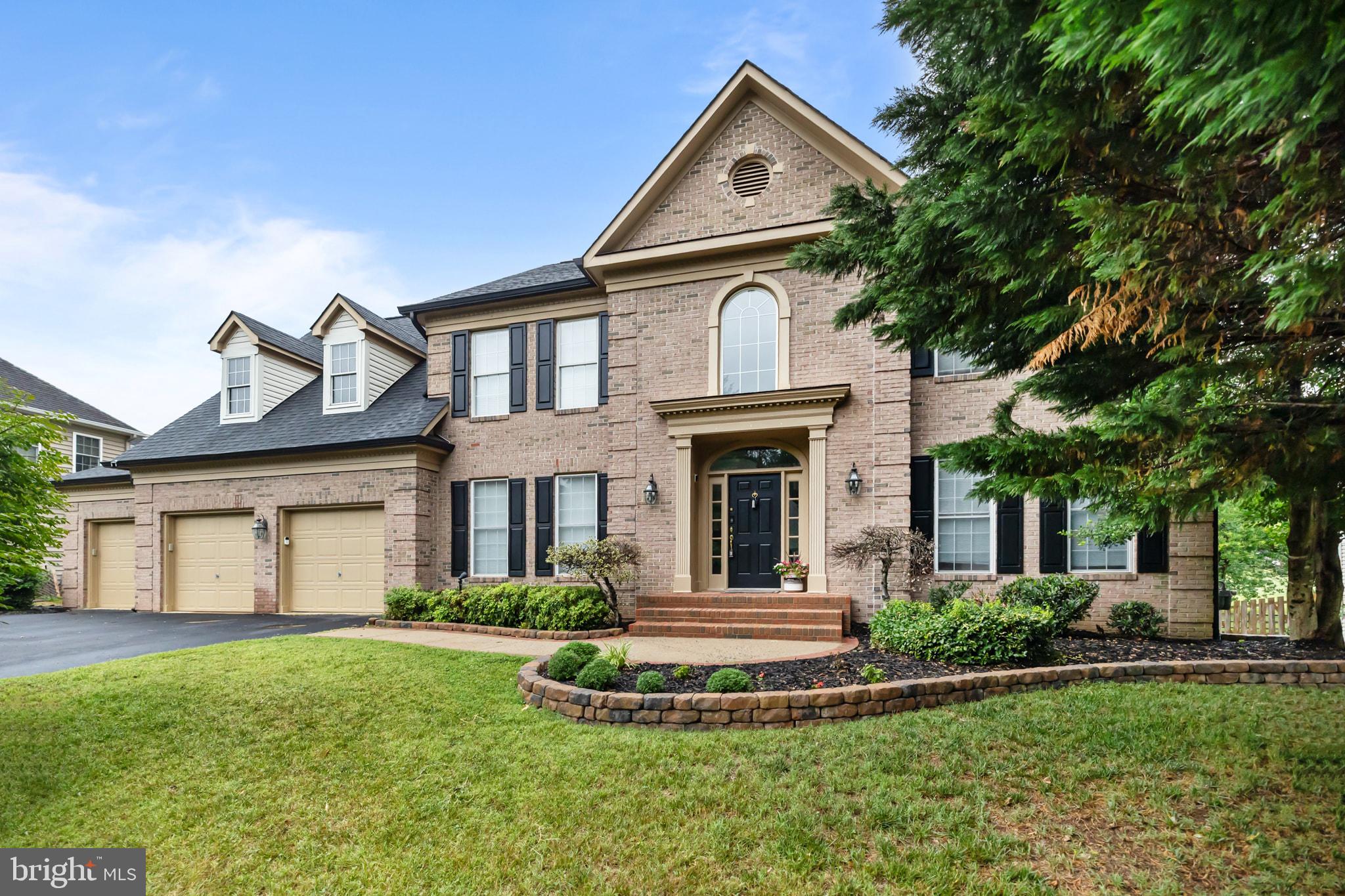 Welcome to this stunning brick estate, beautifully situated in the highly desirable Augustine Community.    A stately three-car garage and sweeping foyer with a cascading staircase create a grand first impression, while rich hardwood floors welcome you into the sophisticated interior.  Designed for both everyday living and entertaining, the main level features a private office with custom built-in shelving and French doors, providing the convenient work-from-home option. Formal living and dining rooms offer refined spaces for hosting special occasions, while the beautifully remodeled kitchen serves as the heart of the home. Complete with an expansive center island, stainless steel appliances, upgraded countertops and backsplash, under-cabinet lighting and abundant cabinetry the kitchen flows seamlessly into the inviting family room featuring a fireplace, coffered ceilings, and a sun-filled morning room. Walls of windows fill the room with natural light, creating an open and airy atmosphere throughout. Upstairs, four generously sized bedrooms provide comfortable accommodations, including a luxurious primary retreat that boasts a large sitting room and a spa-inspired bath featuring heated floors and designer finishes, creating a true sanctuary.   Outdoor living is equally impressive, with a spacious deck overlooking a peaceful backdrop of mature trees, providing privacy and tranquil views year-round. Additional appointments include solar panels for enhanced energy efficiency and long-term savings.  As a resident of the coveted Augustine community, you'll enjoy access to the renowned Augustine Golf Club, along with the resort lifestyle and amenities that make this neighborhood one of the area's most sought-after communities.  Combining timeless elegance, thoughtful upgrades, and an idyllic country club setting, this exceptional home delivers luxury living at its finest