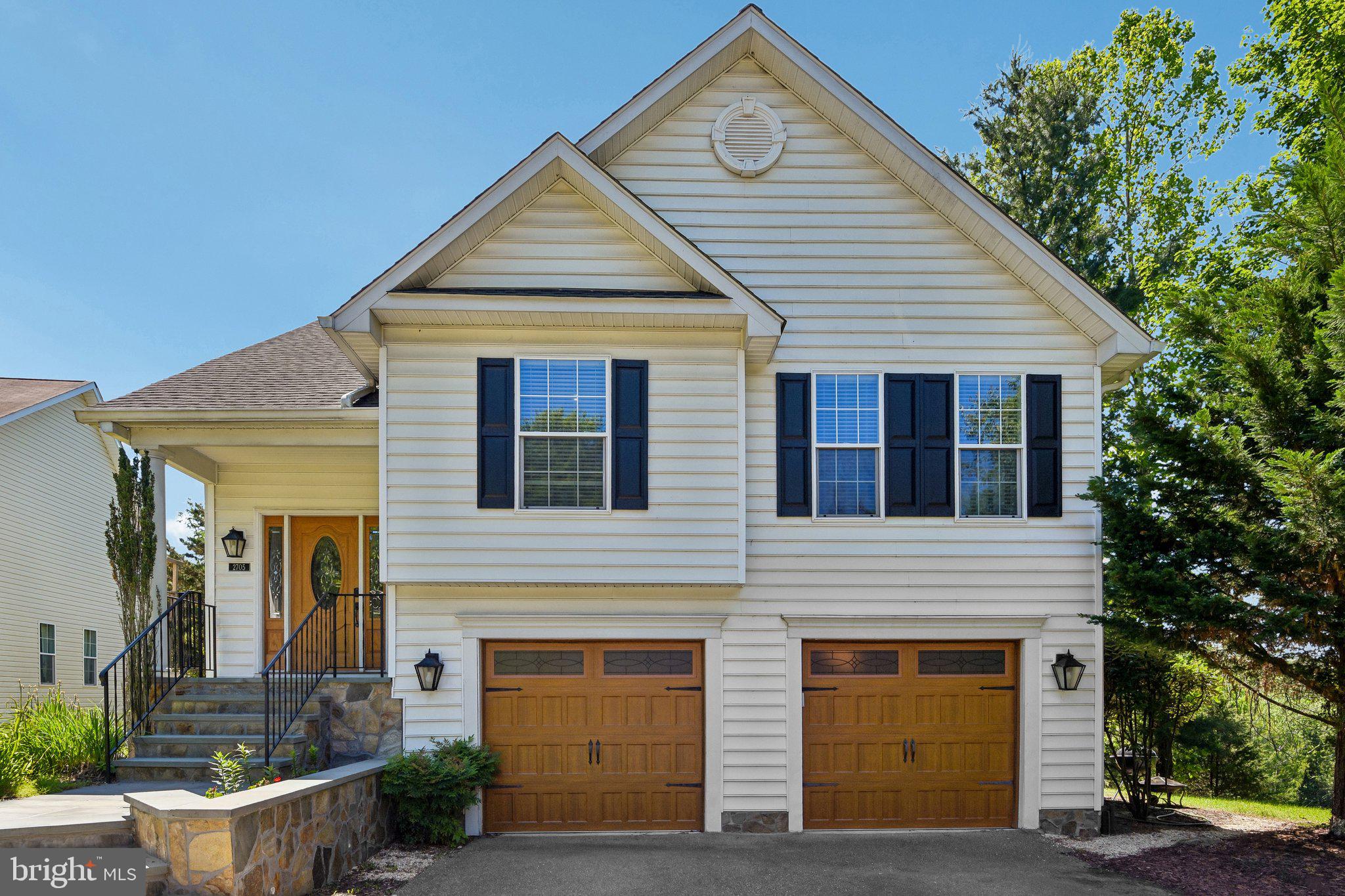 Open House Saturday 12-2. Tucked away on a quiet street in historic Oella, 2705 Westchester Avenue offers a rare combination of privacy, space, and natural beauty. Backing directly to protected parkland and the highly sought-after Trolley Trail 9, this home enjoys a setting that feels miles away from it all while remaining close to everything.

The main living area features 3 bedrooms and 2 full bathrooms, complemented by multiple living and entertaining spaces filled with natural light. A fully finished walkout lower level adds exceptional flexibility with an additional bedroom, full bathroom, and direct access to the backyard patio, making it ideal for guests, multi-generational living, a home office, or recreation space.

One of the home's standout features is the incredible two-level deck overlooking a canopy of mature trees. Whether enjoying your morning coffee, entertaining friends, or simply taking in the peaceful surroundings, the elevated treetop views create a private retreat that's hard to find.

Additional highlights include a two-car garage, abundant living space across multiple levels, and direct access to some of the area's most treasured outdoor amenities. With miles of trails just beyond your backyard and the charm of Ellicott City shops, restaurants, and community events nearby, this is a unique opportunity to enjoy one of Marylands most desirable neighborhoods in a truly exceptional setting.