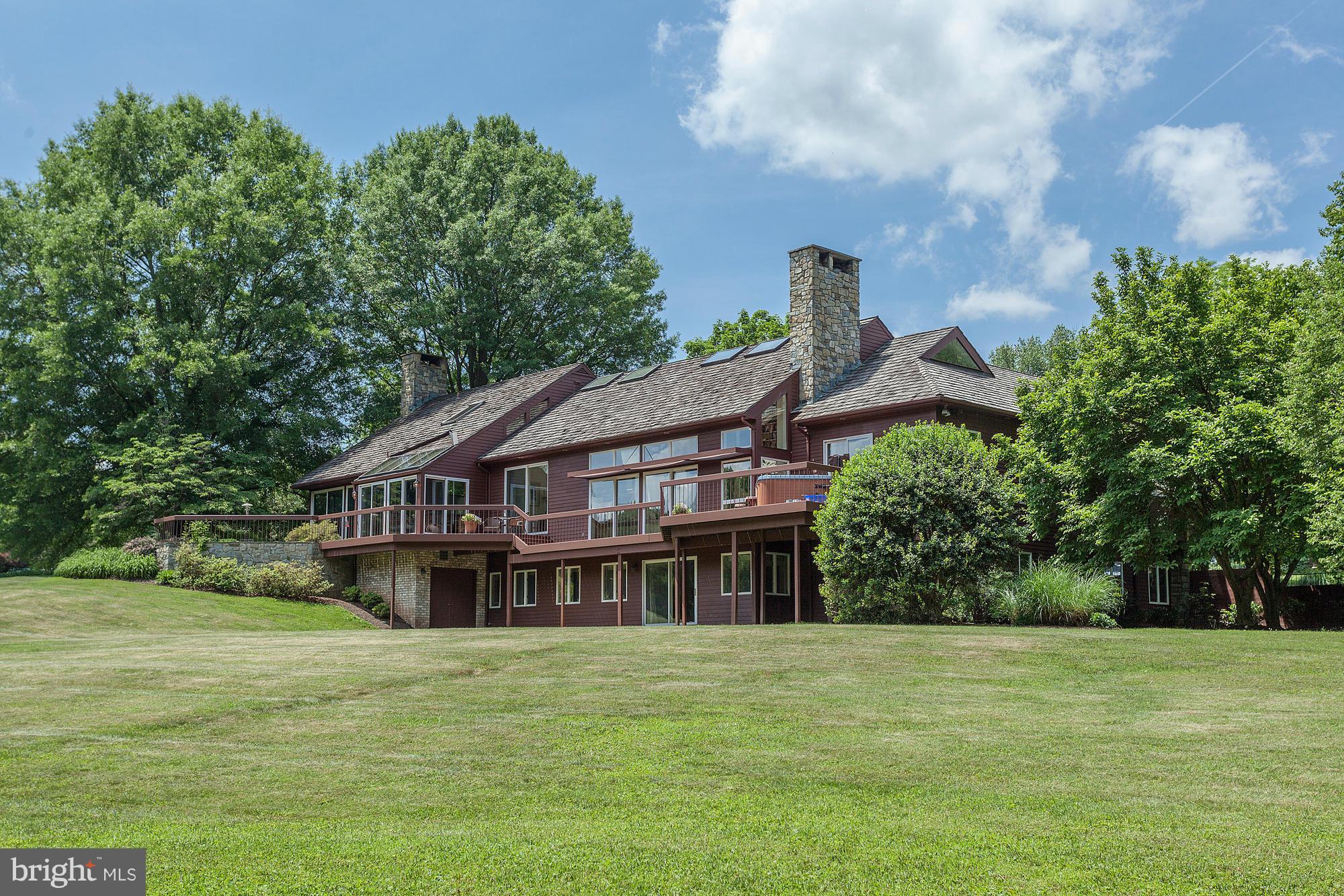 With a spectacular setting sprawling over 7+ gated acres, this residence is truly a one-of-a kind offering. Light-filled home on three levels with a 2-story foyer, gourmet kitchen opening to large family room with cathedral ceilings, main level master suite & walkout lower level. Grounds offer pool w/ spa, tennis court, pond frontage, deck with hot up & circular driveway.