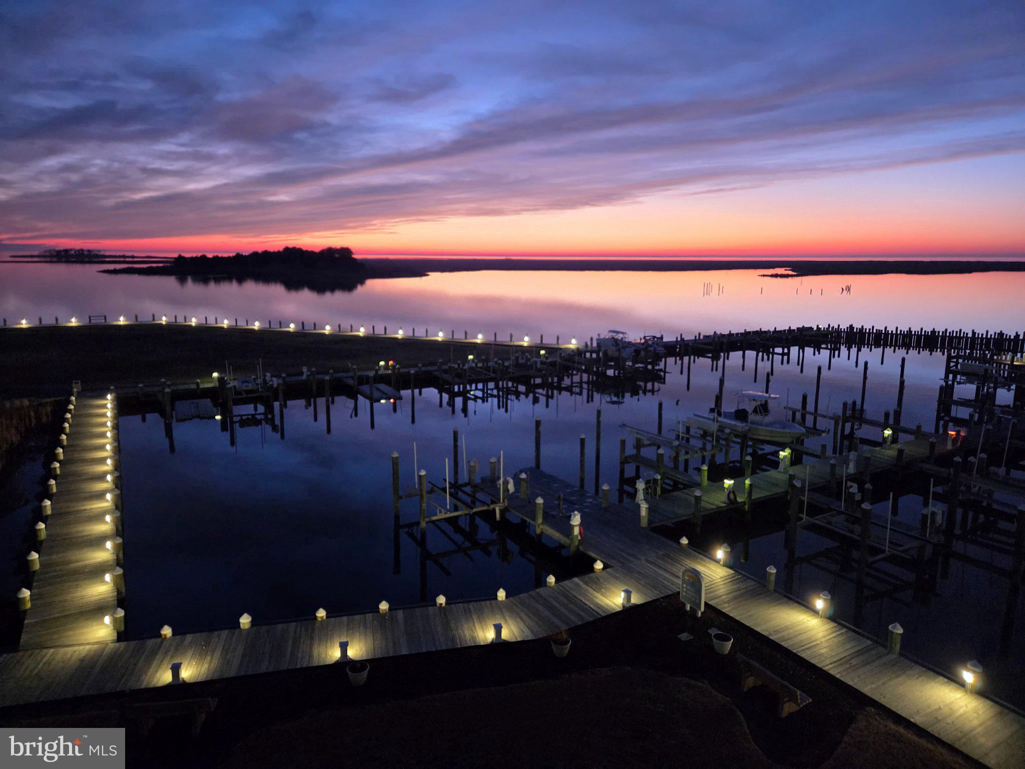 Closing help with full price offer! Eastern Shore waterfront living awaits you at Harbour Light, offering stunning views of the Tangier Sound for a fraction of the cost of most waterfront locations. This beautifully maintained home features 3 spacious bedrooms, 2 full baths, beautiful wood floors, third‑floor water views, and a 40' private deeded boat slip (D‑1)—all available immediately so you can start enjoying those unforgettable sunsets right away.

Step inside to a home that feels completely renovated, clean, and move‑in ready. The centrally located kitchen offers abundant cabinet space, pantry, pull‑out base trays—now enhanced with a new refrigerator, new stove, new sink, new dishwasher, and new backsplash. Additional upgrades include fresh paint, a renovated bathroom, new sliding glass doors, new ceiling fans, new washer and dryer, a new programmable thermostat, and remote‑controlled blinds for effortless comfort.

Enjoy beautiful water views from the living room, kitchen, primary bedroom, balcony, and screened porch. A separate laundry/utility room provides extra storage for pool gear or fishing supplies, while the exterior storage closet is perfect for tools, toys, and tackle. Elevator access, a heated community pool, and a pool house with men’s and women’s changing areas and a full bath house add exceptional convenience and comfort.

The location is exceptional—close to medical offices, with a new medical annex opening soon, plus nearby shopping and walkable restaurants and cafés that make everyday living easy and enjoyable.

Outdoor lovers will appreciate being just minutes from Janes Island State Park, Somers Cove Marina, Wellington Beach, and easy access to boating, biking, crabbing, and seasonal duck hunting.

Crisfield offers year‑round charm with beloved local events including the Soft‑Shell Festival, Freedom Fest, Tangier Sound Music Festival, and the Crab & Clam Bake. Whether you're seeking a full‑time residence, a weekend escape, or an investment opportunity—this is coastal Eastern Shore living at its finest.
internet/cable, water, security and a Deeded dock all included.