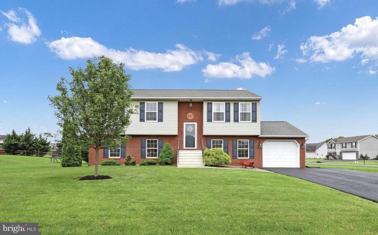 Some homes make you feel it the moment you pull in. This is one of them.
Set on nearly ¾ of an acre in one of Greencastle's most sought-after neighborhoods, 852 Bristol Drive is the kind of home buyers wait months to find and the moment it hits the market, the clock starts ticking.

Step inside and you're immediately greeted by fresh, luxury vinyl plank flooring that flows throughout the main living areas, clean, modern, and virtually maintenance-free. The kind of upgrade that makes the whole house feel new. Retreat to the carpeted bedrooms for warmth and comfort where it matters most.

The kitchen and dining room open directly onto a large deck that was made for living. Morning coffee. Summer dinners. Saturday evening gatherings that stretch well past dark. With nearly ¾ of an acre behind you — flat and spacious you have the outdoor space most buyers only dream about at this price point. A sizeable storage shed means the garage remains a garage.

And speaking of the garage, the attached one-car garage keeps your vehicle protected year-round, with direct interior access that you'll appreciate every single winter morning.

Inside, the lower level adds a dimension most homes simply don't have. A full second living room means everyone gets their own space , a family room, a teen hangout, a home theater, a guest retreat, a home office that actually feels like one. Whatever your life calls for, this home bends to fit it. Three full bathrooms across two levels means no one is ever waiting, no one is ever inconvenienced.

And here's the peace-of-mind detail savvy buyers always ask about: the roof was replaced in 2021. No looming capital expenses. No negotiating credits. Just move in and live.

Four bedrooms. Three full baths. Two living spaces. A deck built for entertaining. Nearly ¾ of an acre. A newer roof. A garage. Luxury finishes. All of it in Greencastle, minutes from I-81, in the Greencastle-Antrim school district, with small-town charm and easy access to everywhere you need to be.

This is the one people will be kicking themselves for not seeing sooner. Don't be that person.

📞 Call today to schedule your private showing,  homes like this don't sit.