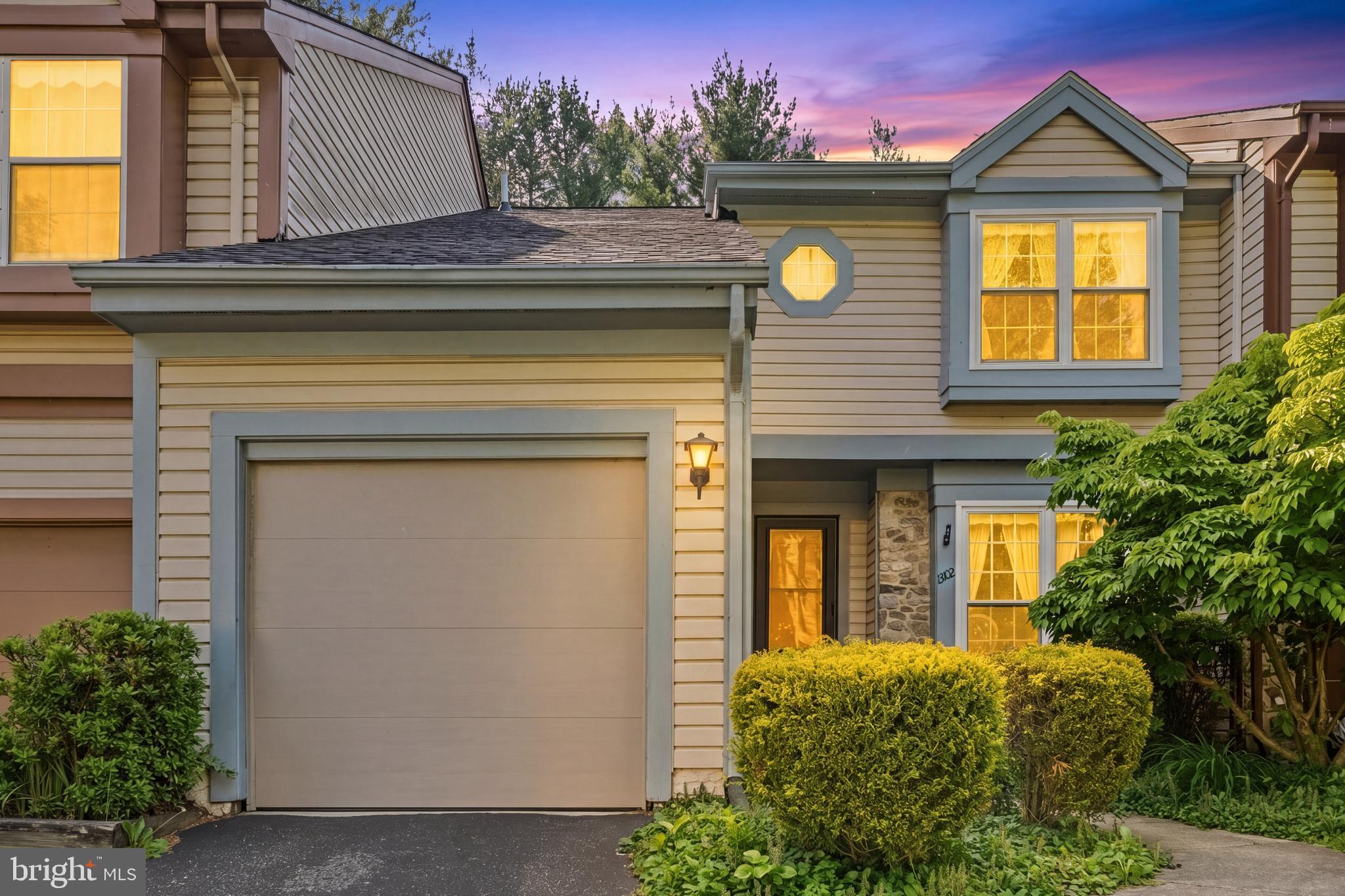 Welcome home to this charming residence filled with warmth, character, and functional living space throughout. Beautiful wood floors flow across the main level, creating an inviting atmosphere from the moment you enter. The eat-in kitchen offers ample room for casual dining and everyday gatherings, while French doors bring in natural light and lead directly to the back patio and fenced backyard. Outside, enjoy a peaceful setting with a lovely garden and a stunning Japanese maple that adds seasonal beauty and privacy. The cozy living room with a fireplace provides the perfect place to relax or entertain guests. An attached garage adds convenience and extra storage space. Upstairs, the spacious primary suite features a dedicated vanity area, while two additional generously sized bedrooms provide flexibility for guests, home office space, or hobbies. The finished basement with a half bath offers even more room for recreation, fitness, or movie nights.