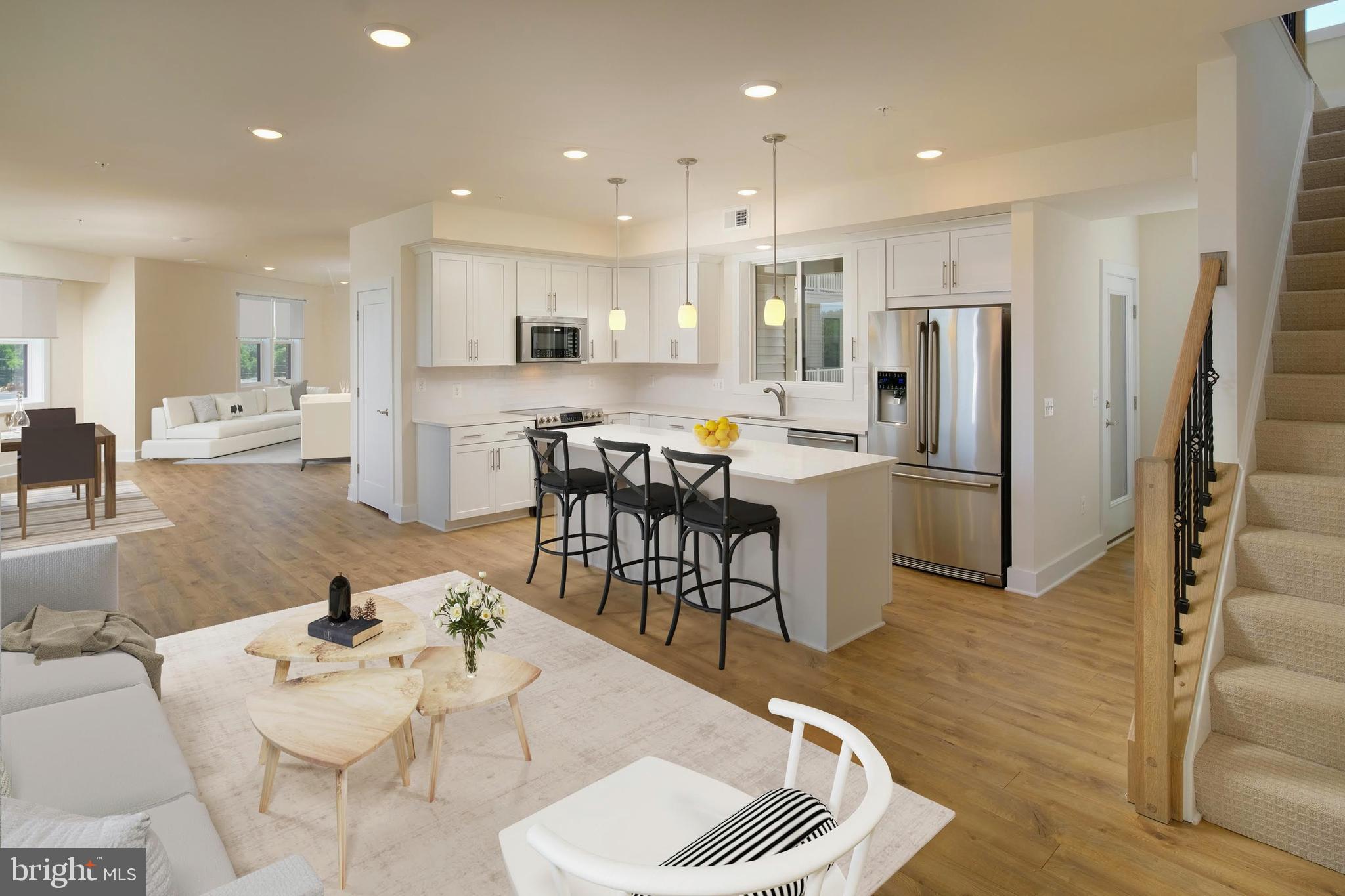 Brand new Stanley Martin townhome-style garage condo within walking distance to the silver line metro!
Penthouse-style living! Only 4 homes like this in the whole community. Welcome to The Cavendish 2-level garage condo at Ashburn Station! Step into this 2,771 sqft oasis and be greeted by the main level's open floorplan, seamlessly connecting the kitchen, dining area, family room, library, powder room, and a fabulous deck. Imagine hosting unforgettable dinner parties and holiday gatherings in this elegant space, where laughter and good memories fill the air. Now let's talk about the primary bedroom, a true sanctuary. With its spaciousness, charming sitting area, and en suite bathroom, you'll find yourself escaping to this private retreat after a long day. Picture yourself unwinding with a good book or enjoying a glass of wine as you take in the serene surroundings. In addition to the primary bedroom, you will find two more generously sized bedrooms on the upper level, along with a convenient hall bath. This ample space ensures everyone's privacy and comfort. Located in a vibrant and thriving community, The Cavendish Condo is just moments away from top-rated schools, trendy shops, delicious dining options, and the convenience of major highways for easy commuting. The photos shown are from a similar home. Contact us to schedule a tour or stop by and visit our model homes today!

Ashburn Station within walking distance of the silver line Metro in Northern Virginia. This neighborhood offers an ideal location close to major commuting routes and some of the area's largest employers.
Enjoy amenities dispersed throughout this new neighborhood including a gaming lawn, 2 workout stations, a playground, and multiple community parks featuring greenspace, firepit, grilling station, and outdoor seating. This location is a short walk or quick drive to the many shopping, dining and entertainment options throughout central Loudoun County.
Ashburn Station is an ideal choice for residents who want to work and play close to home. Visit us today!
